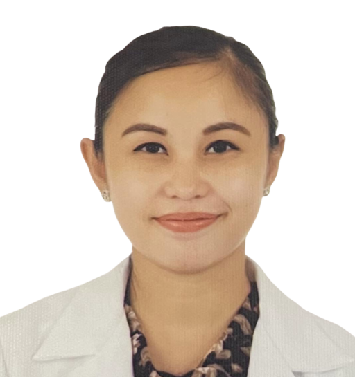 A woman with dark hair styled back, wearing a white lab coat and a patterned blouse underneath, smiling at the camera.