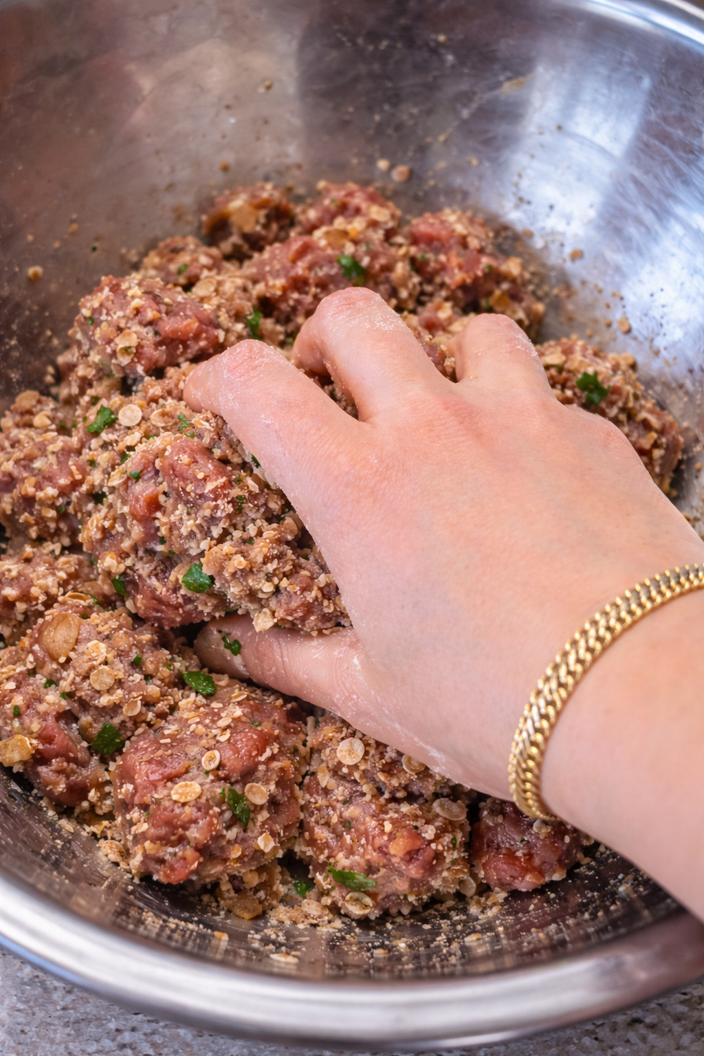 mixing-beef-meatballs-by-hand.jpg.png