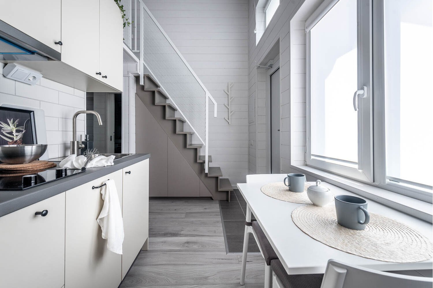 Kitchen and staircase in a studio in Gothenburg