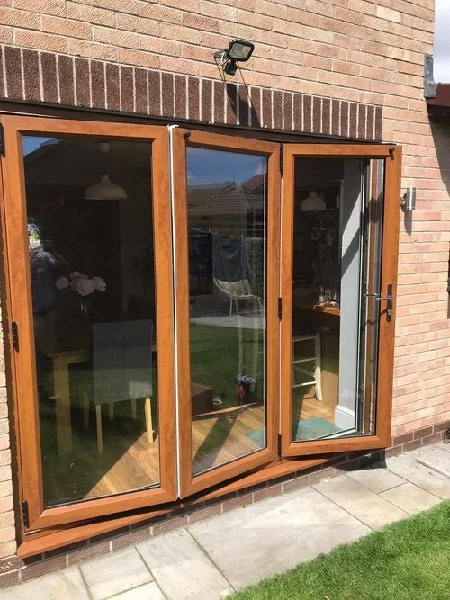Wooden exterior patio doors before spray painting.webp