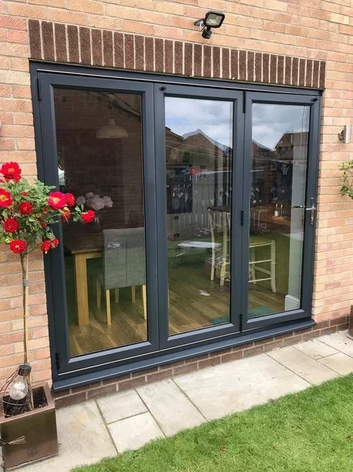 Modern grey patio doors after professional spray painting.webp
