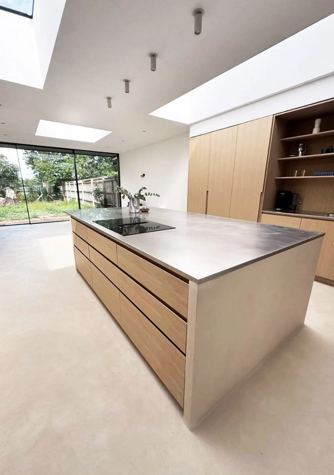 Modern light-filled extension microcement floor in Stratford-on-Avon by Unity Architects