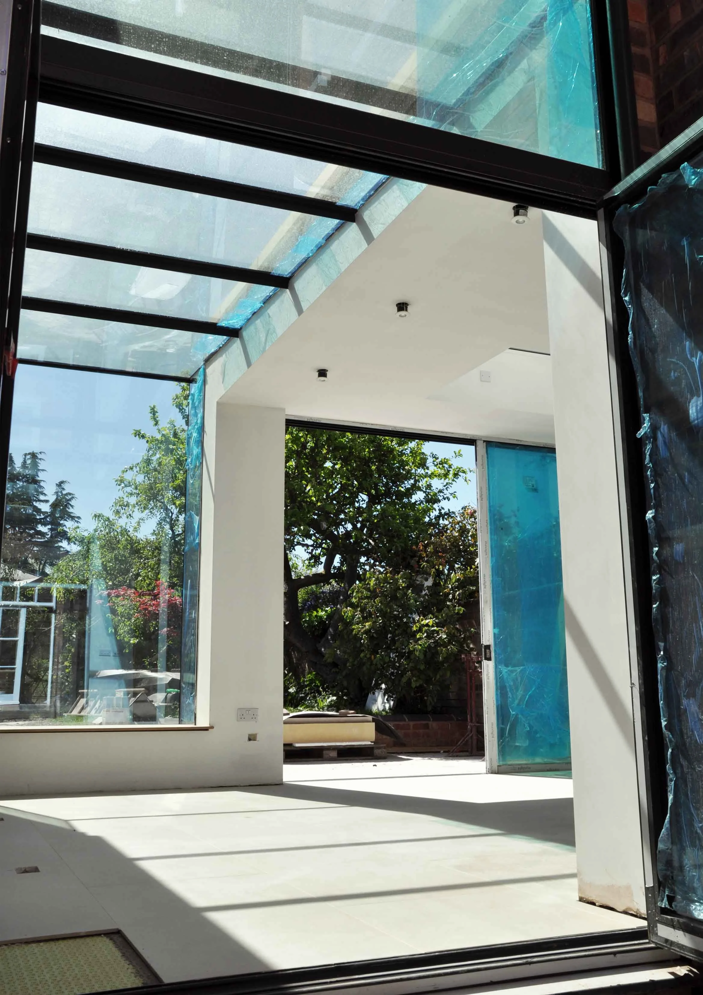 Construction photograph showing structural glass roof in Leamington Spa by Unity Architects