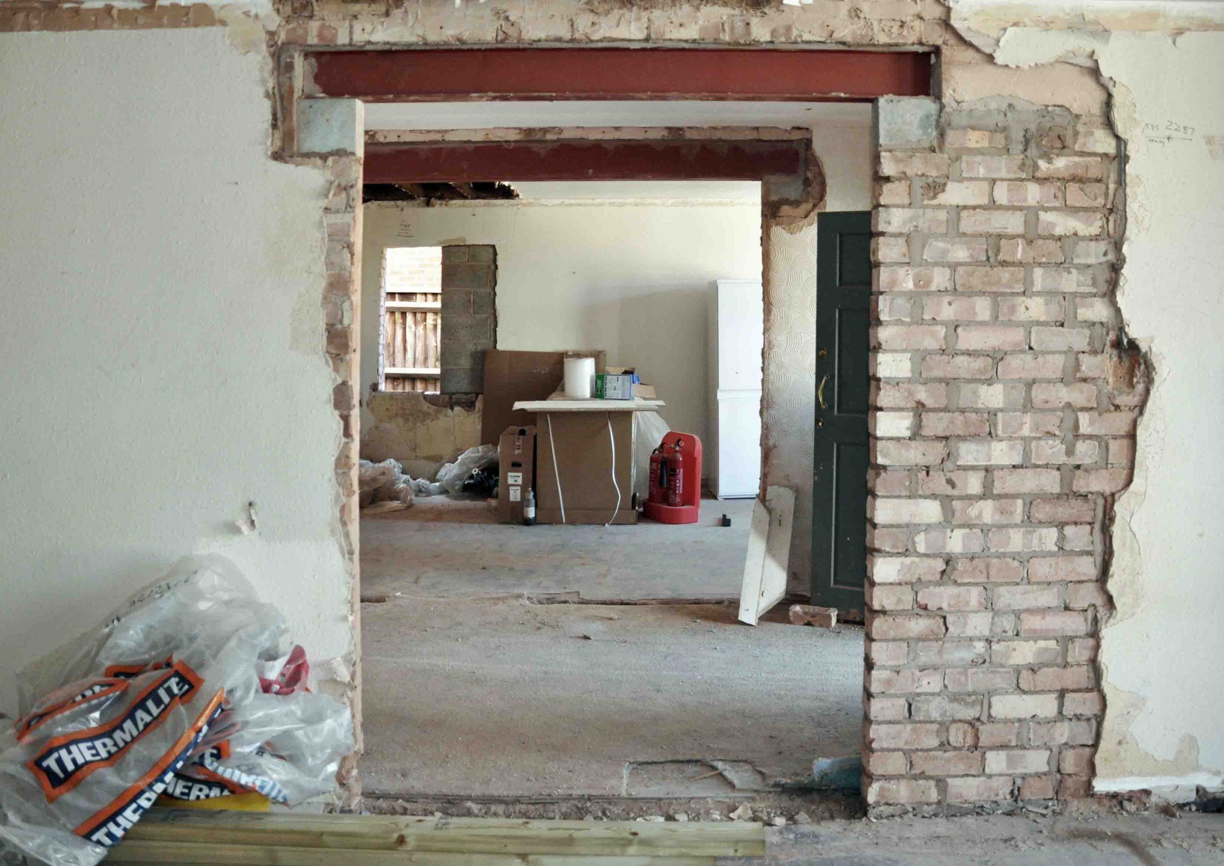 New structural opening showing steel beams padstones and exposed brickwork by Unity Architects Leamington Spa