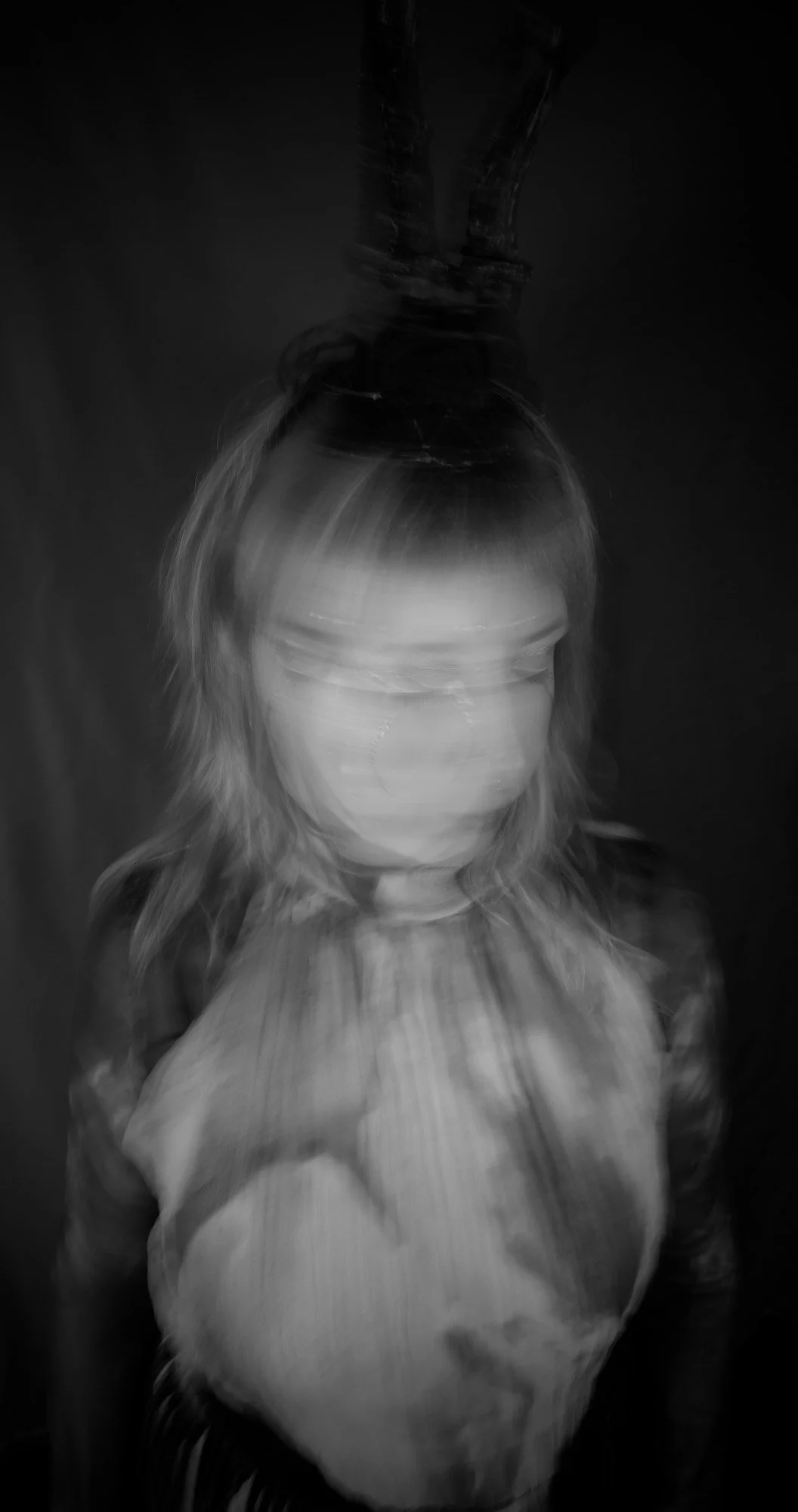 Portrait of Isabella Rosa, artist and founder of ISAROS, long-exposure black and white image