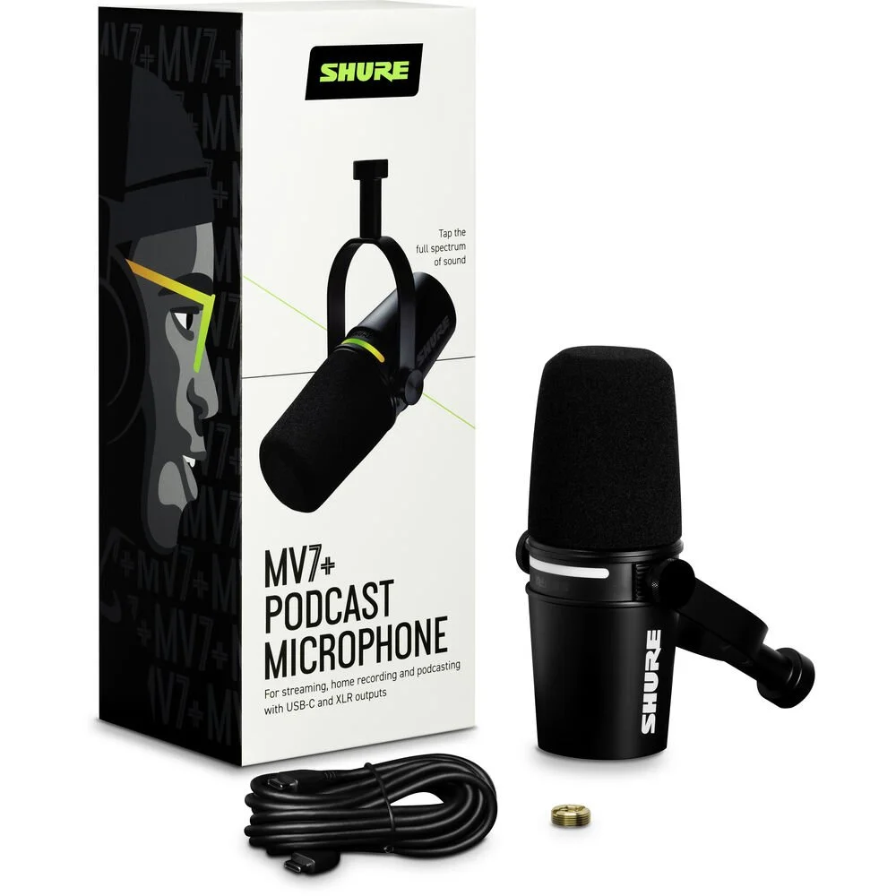 Shure MV7+ USB microphone next to its retail packaging and included USB C cable