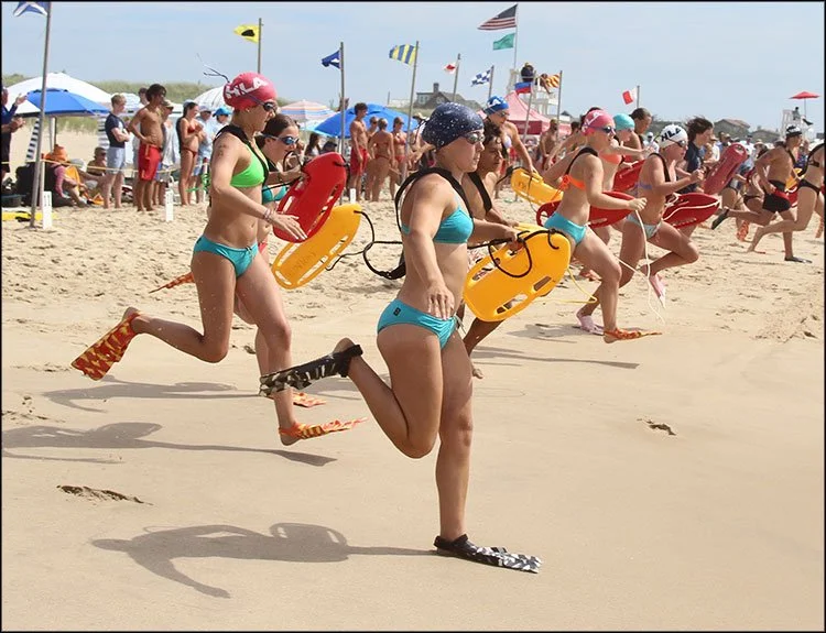 Competitors raced to the water for the torp rescue event at the junior lifeguard tournament on Sunday.