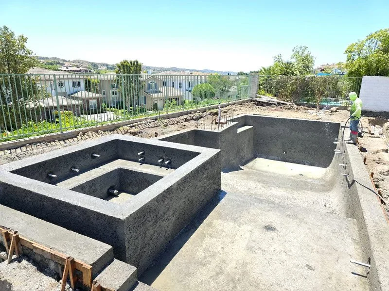 square pool with raised spa and baja