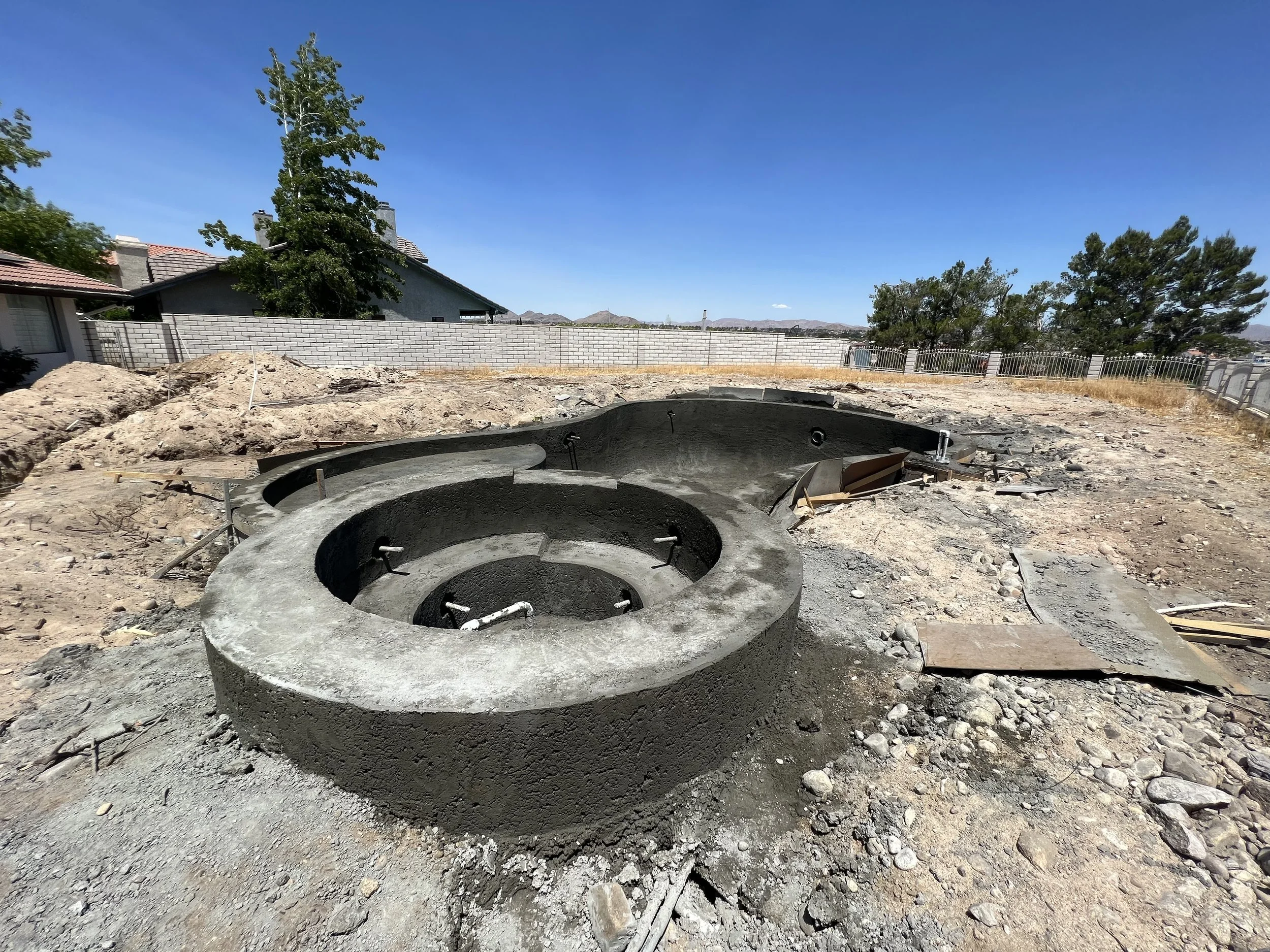 freeform pool with raised spa and baja