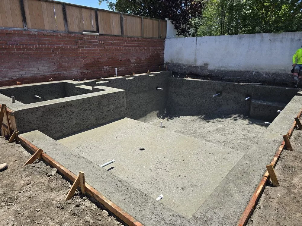 square pool with spa and baja
