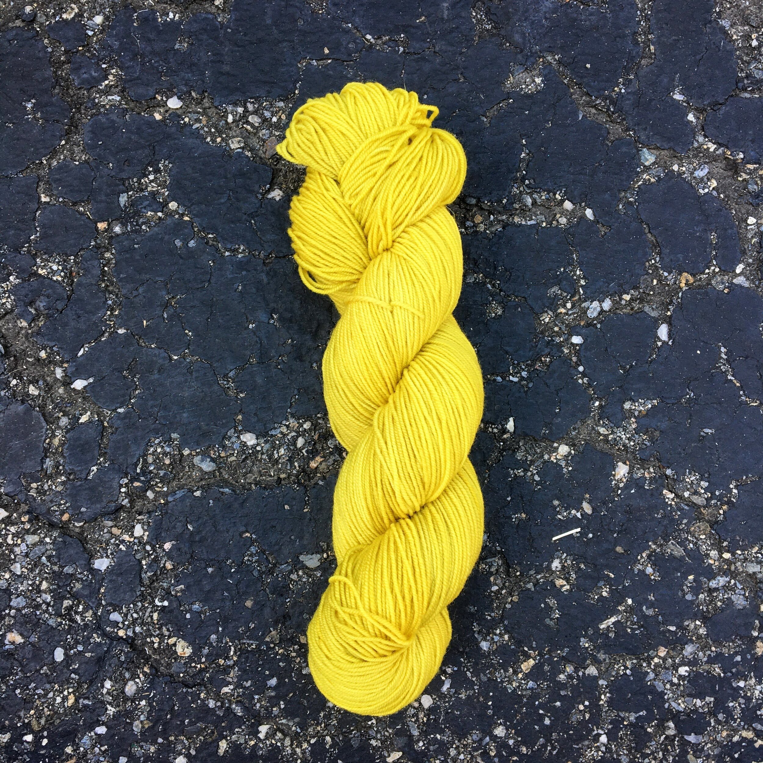 A skein of green/ yellow yarn