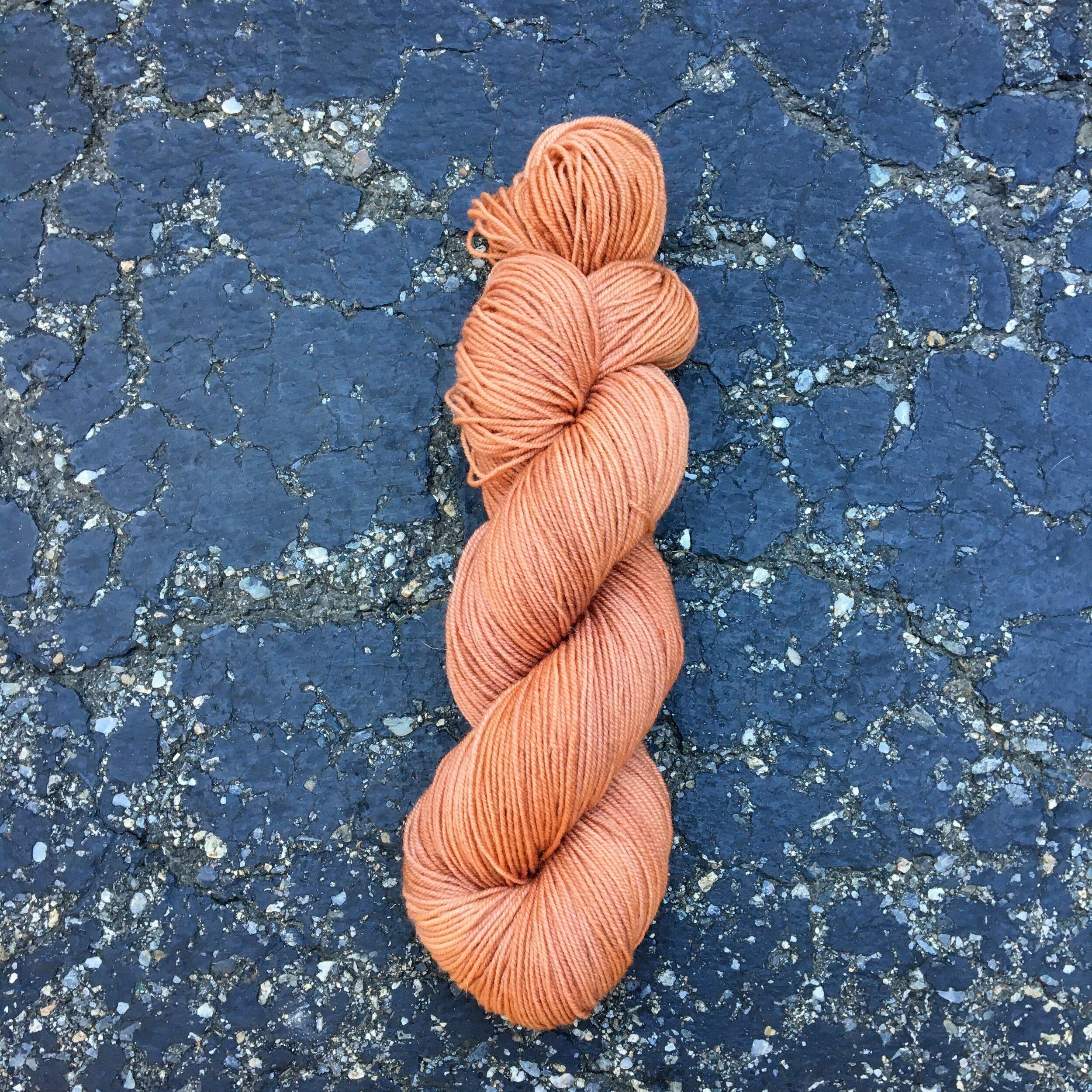 A skein of light brown yarn