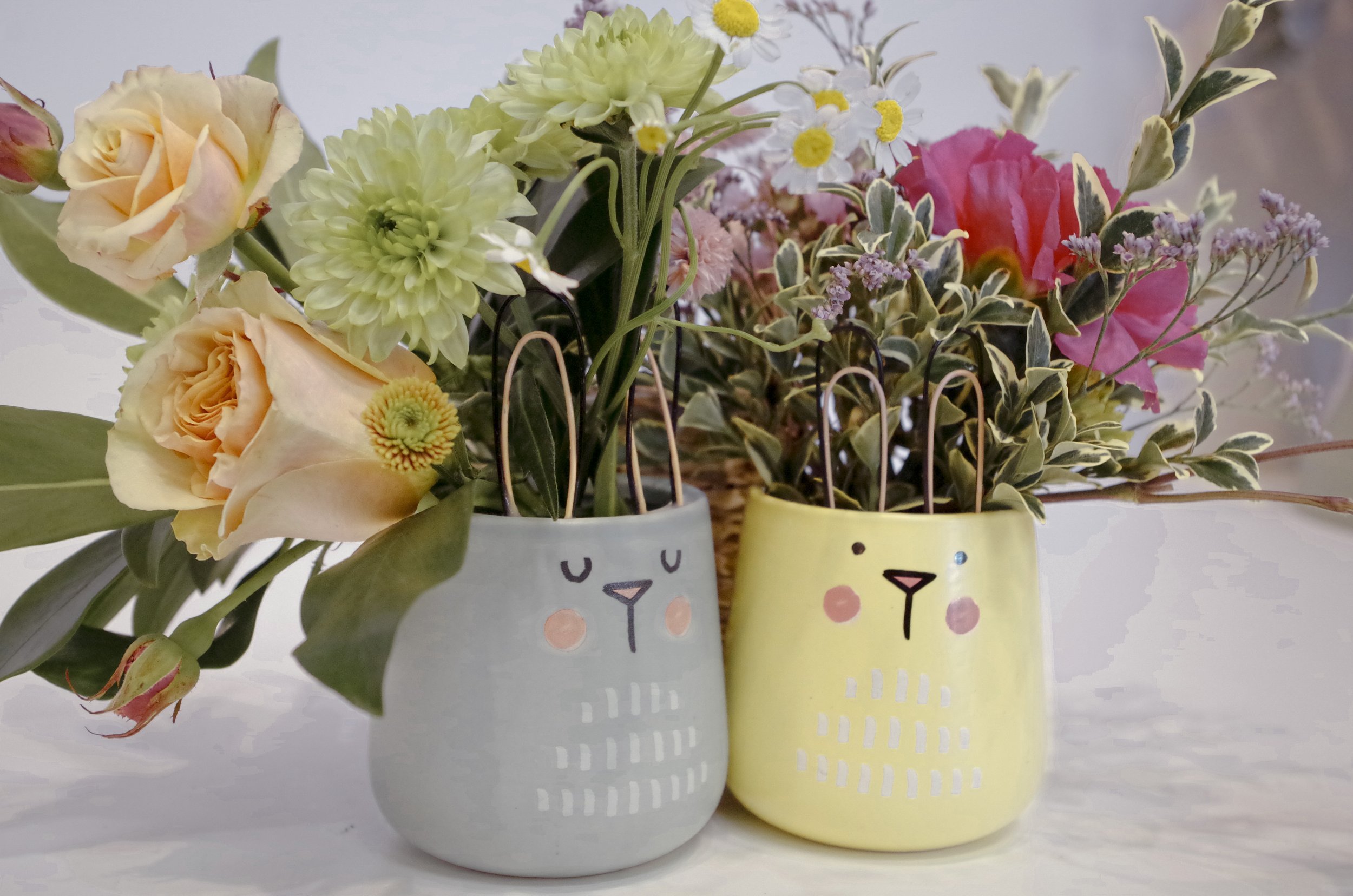 Cute DIY bunny flower jars with bright seasonal blooms for a kid-friendly spring craft