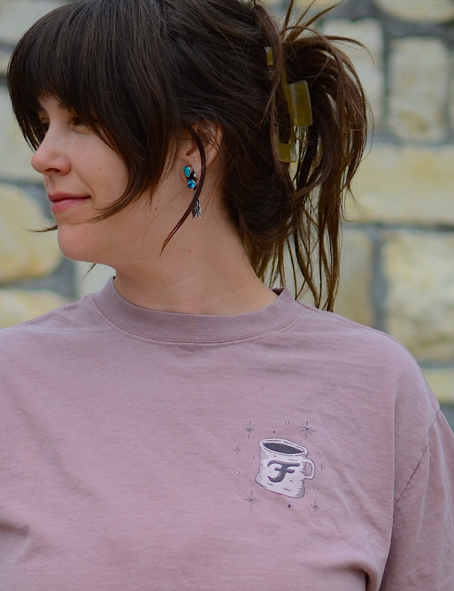 Woman showing front of tee