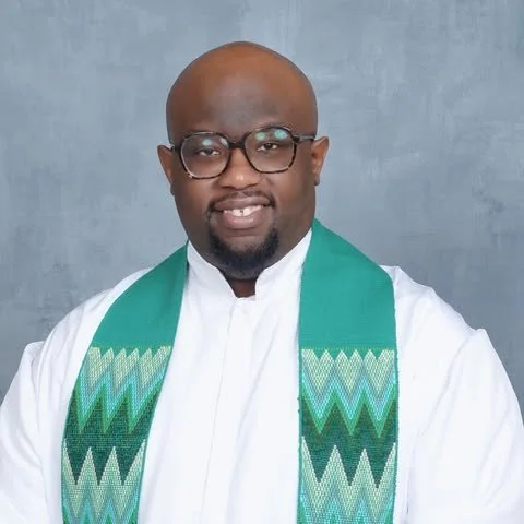 Pastor Davanta R. Scruggs Sr. wearing a green pastoral stole