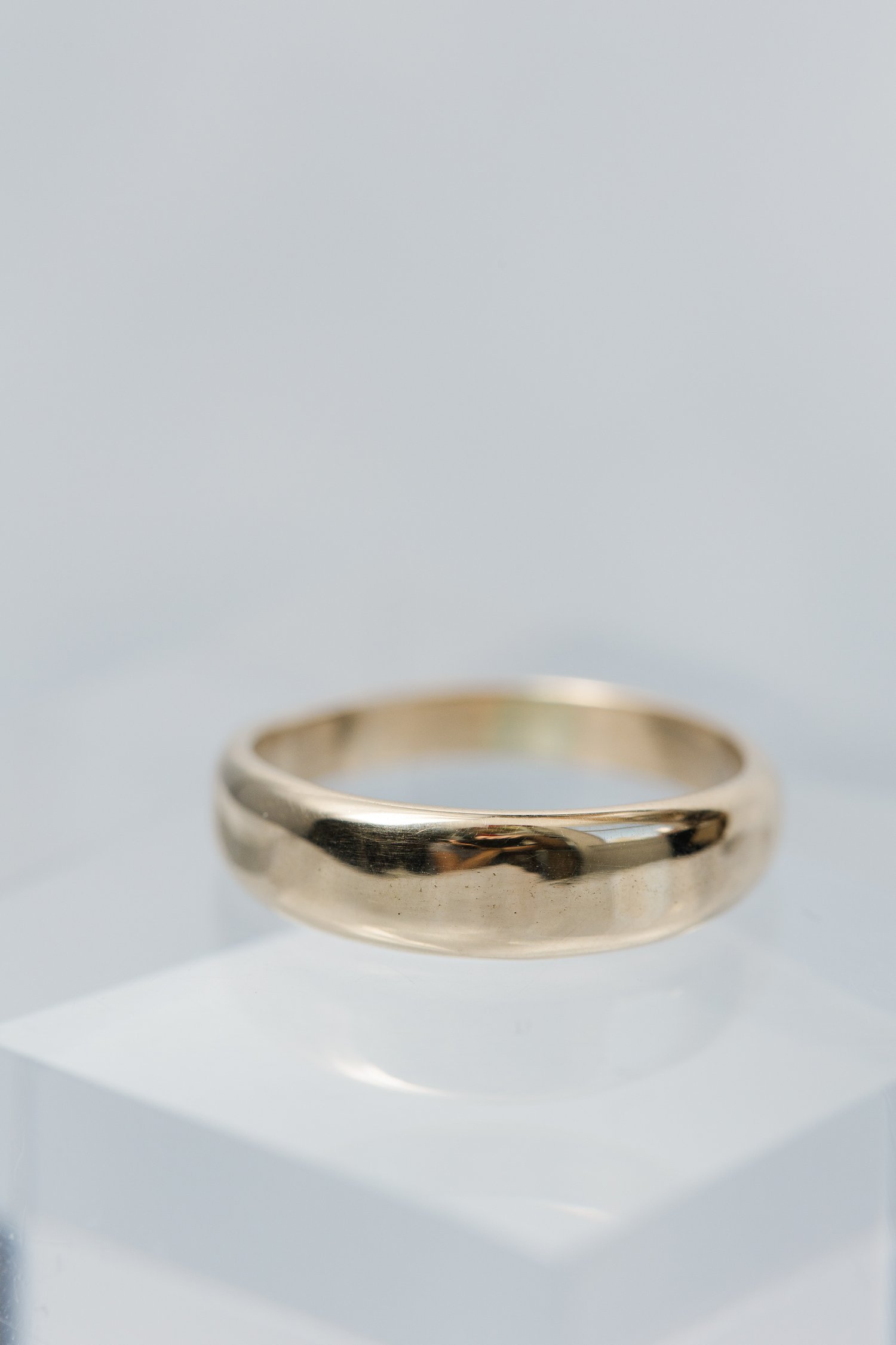 custom made tapered recycled yellow gold mens wedding band featuring a diamond made by Alexandria &amp; Company fine jewelers