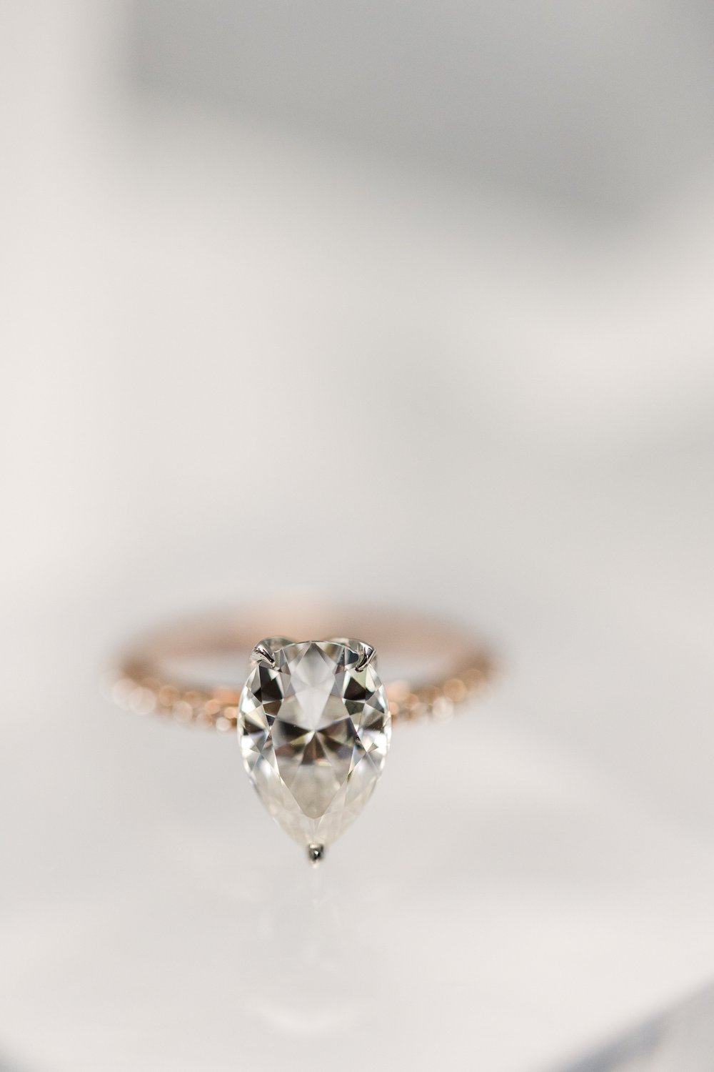 custom designed pear cut diamond engagement ring set in rose gold made by Alexandria &amp; Company in Old Town Alexandria 