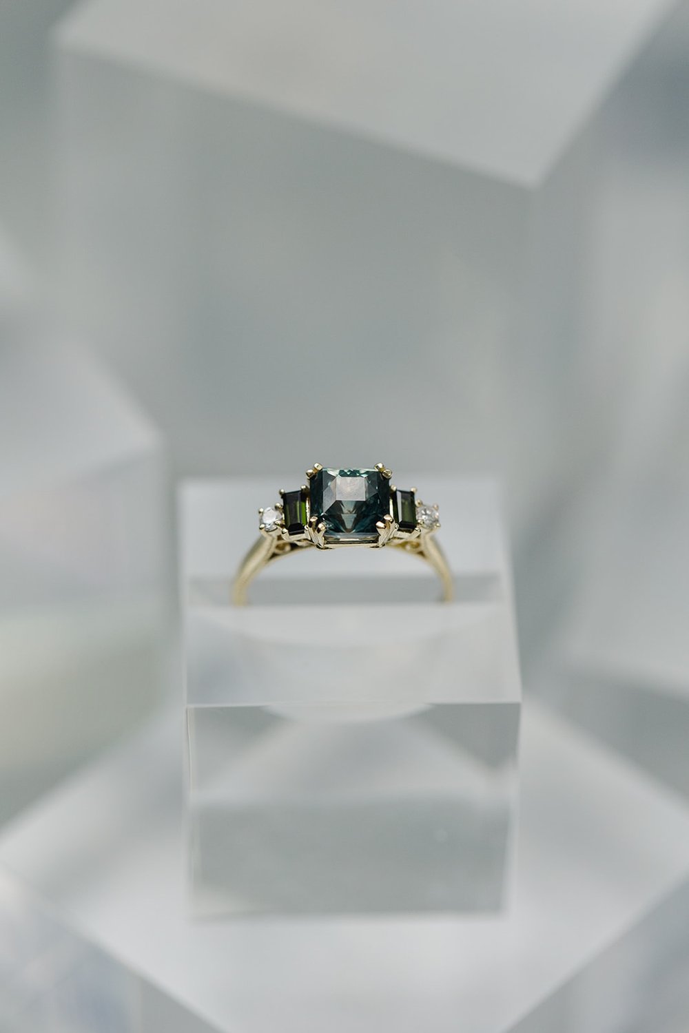 Alexandria and Company designed engagement ring set with a green Montana sapphire and forest green tourmaline and diamonds
