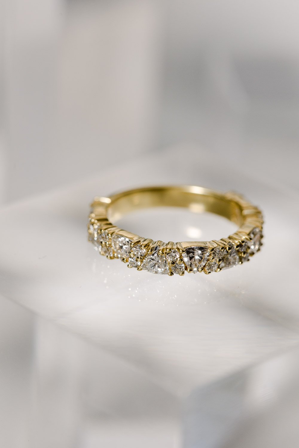 Custom made trillion and round cut diamond and yellow gold wedding band designed by Alexandria &amp; Company 
