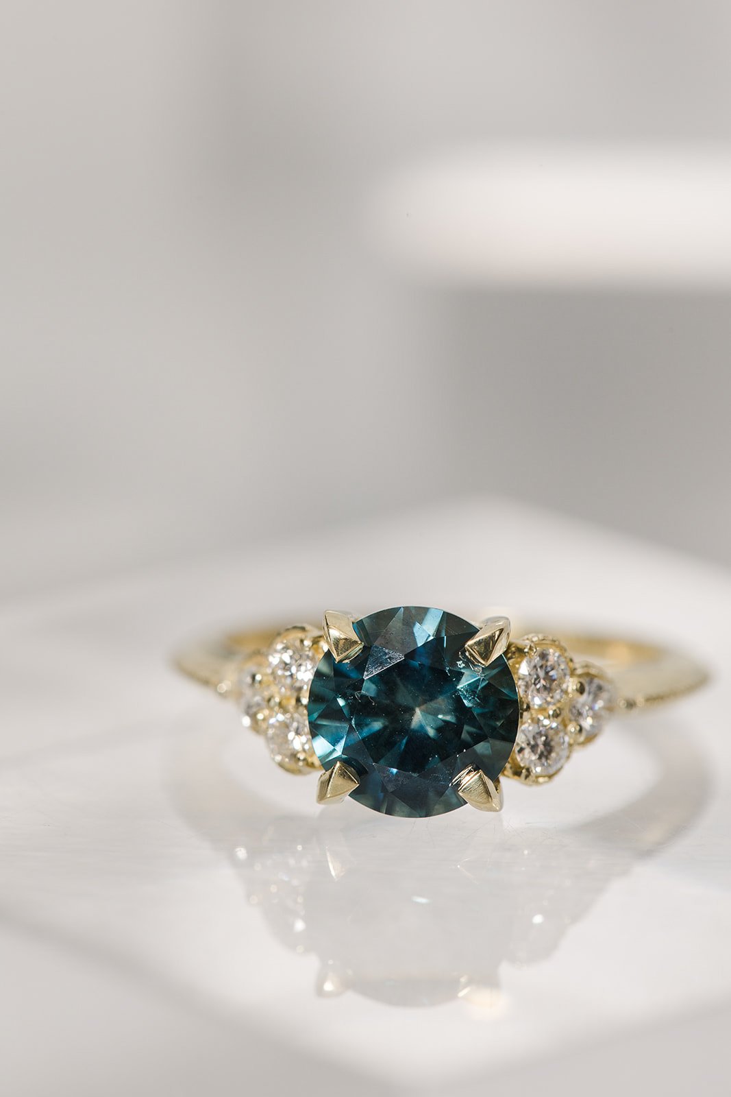 teal green sapphire engagement ring