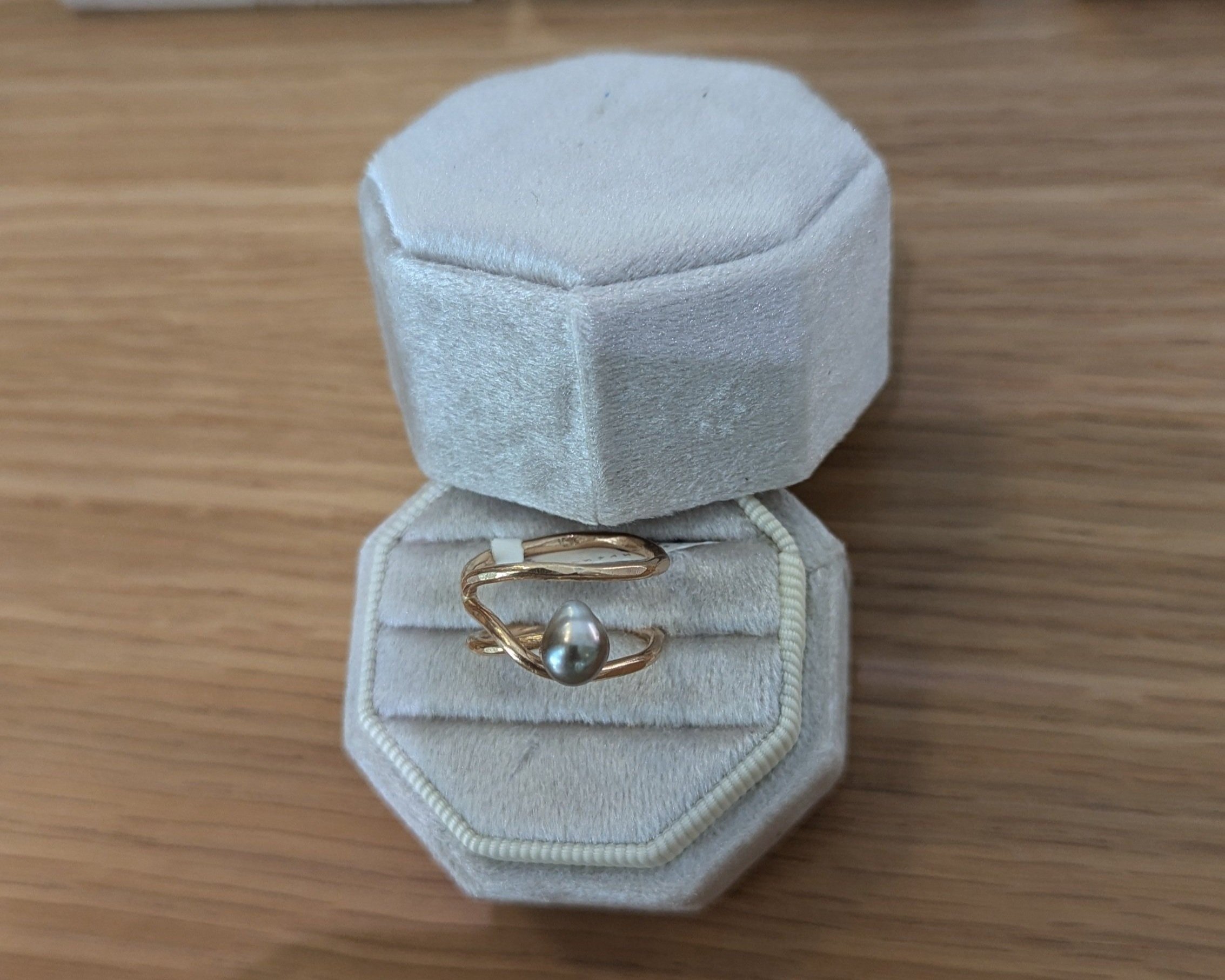 Handmade spiral ring with Tahitian Keshi pearl in 14k gold fill in display box