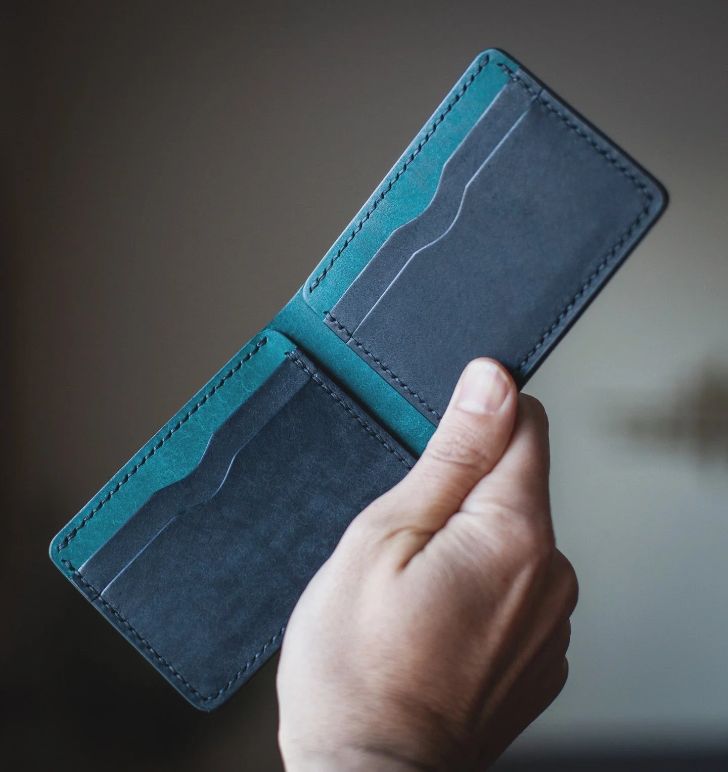 Cool personalized custom color combo. Black and blue sleek bifold. 

#leathercraft #customwallet #leatherwallet #bifoldwallet #madeintheusa🇺🇸