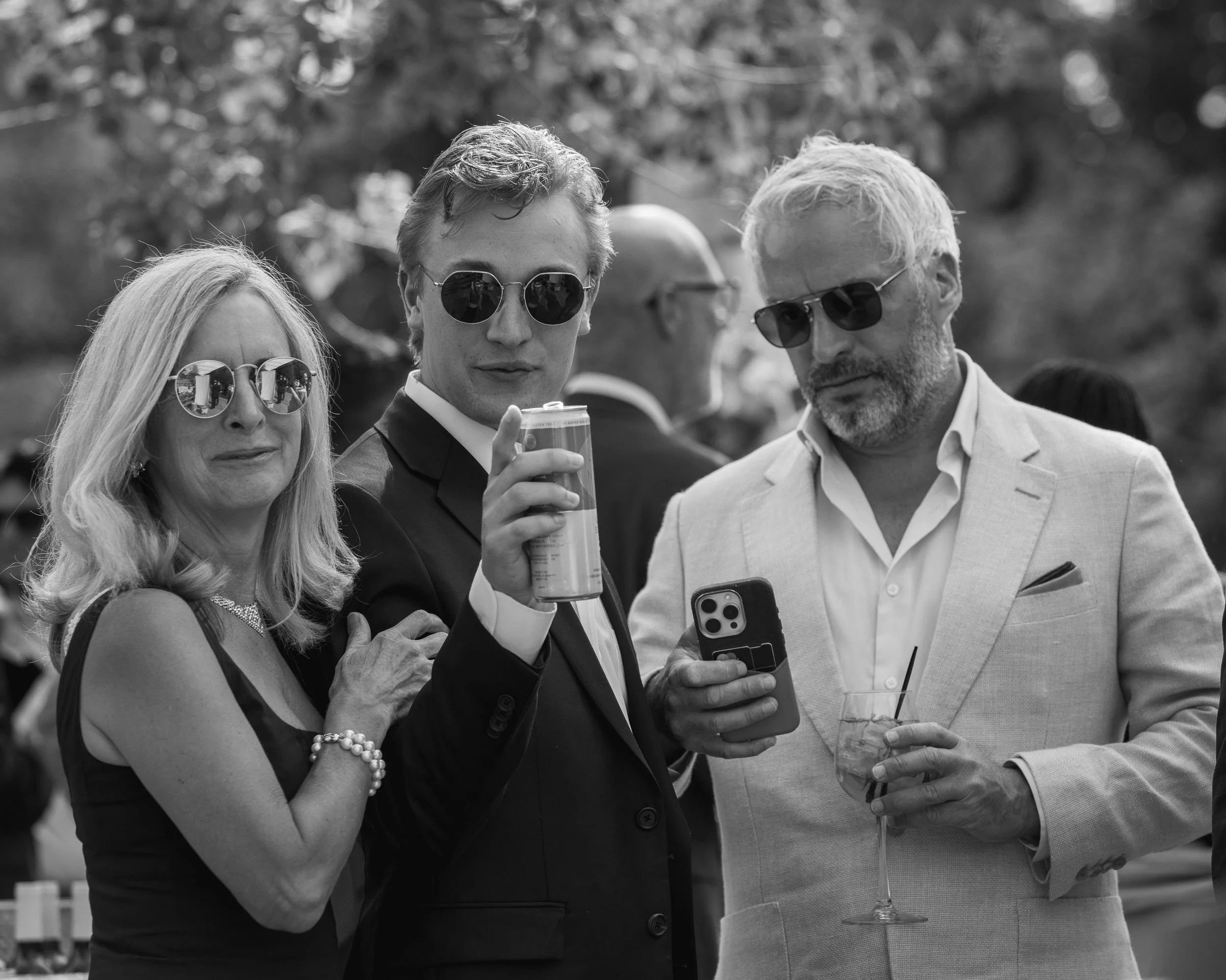 Grand Targhee Resort, documentary Wedding photography; a mother, son, and father taking a candid photo together, son pointing at camera