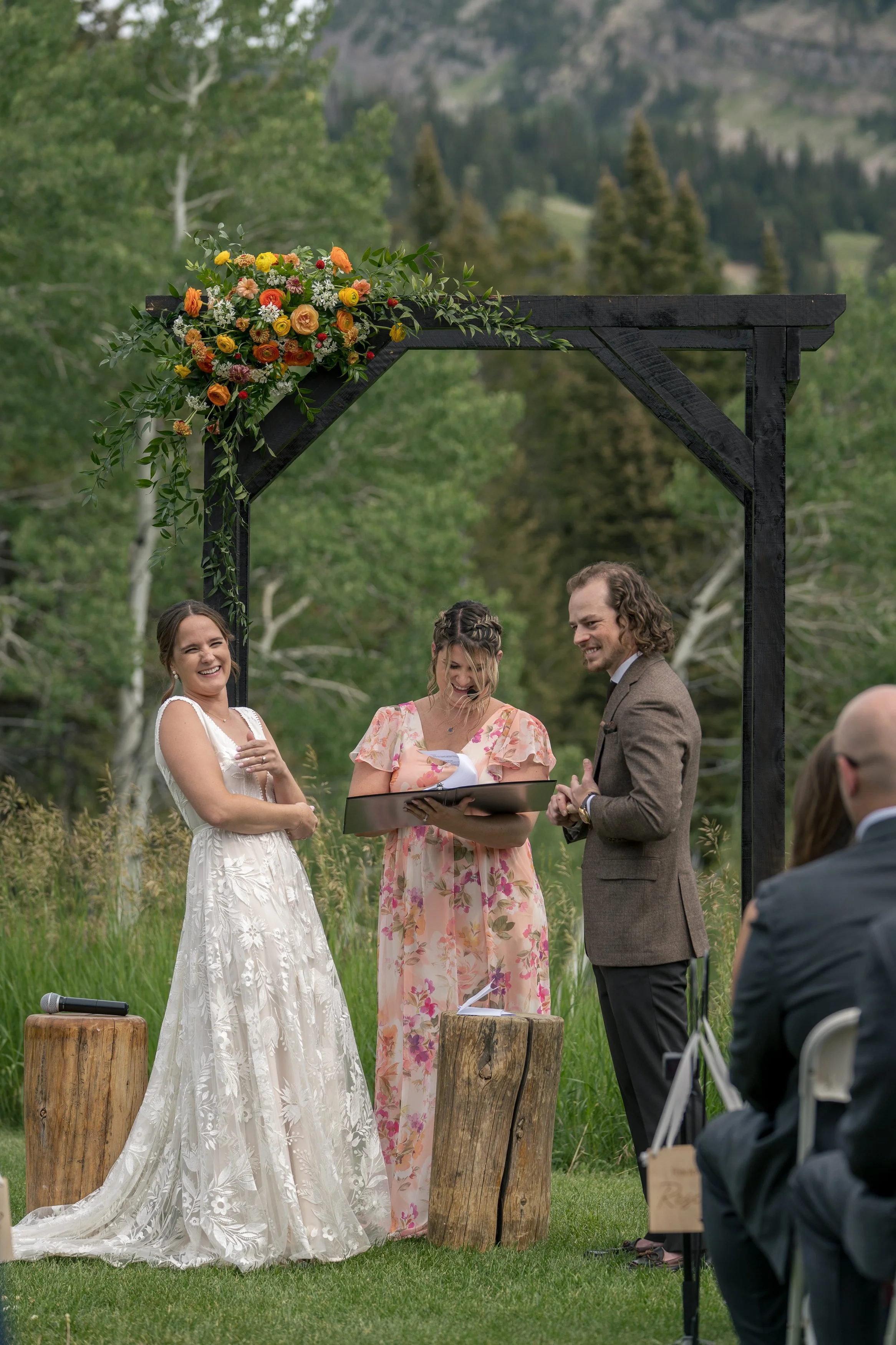 Grand Targhee Resort, documentary Wedding photography; bride and groom at altar laughing as groom puts on sticky ring