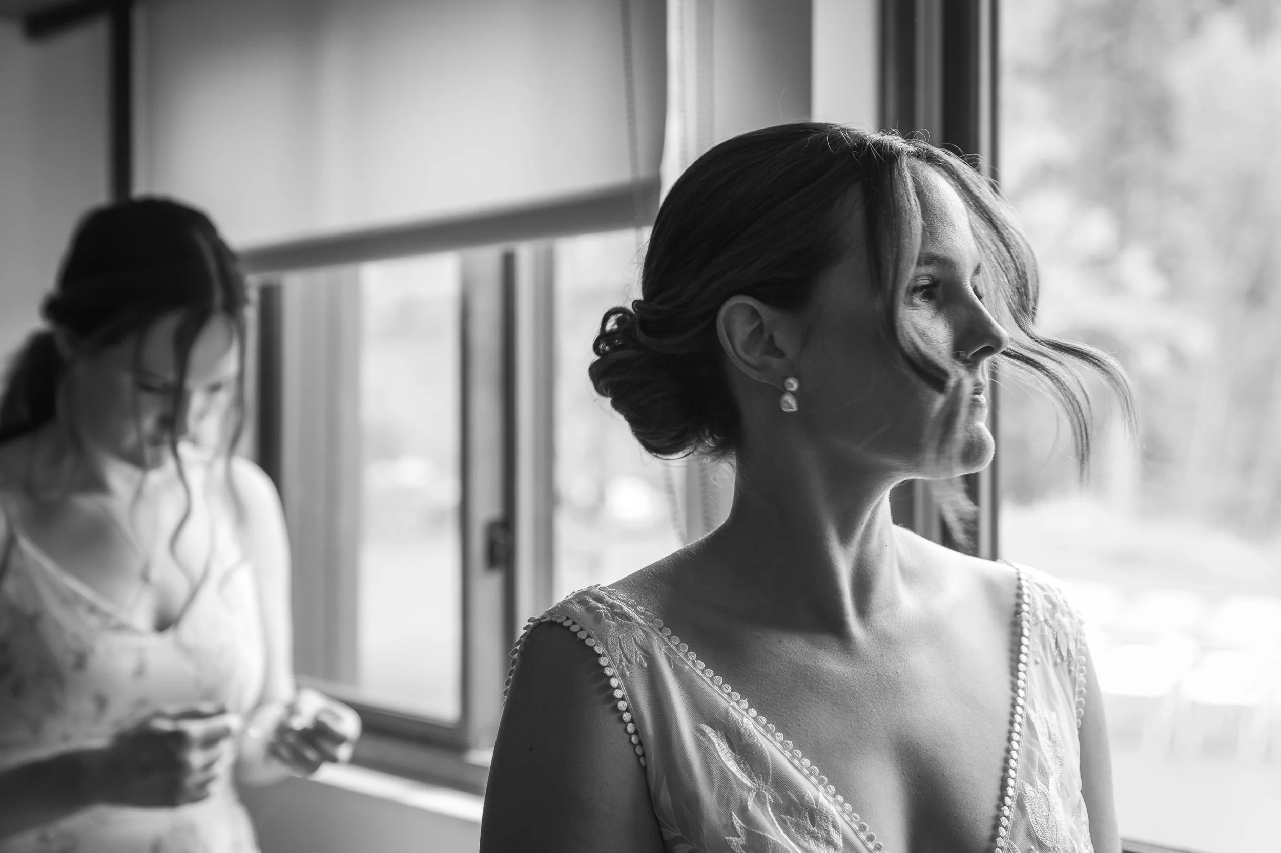 Bride and sister getting ready in bridal suite at Grand Targhee Wedding, documentary wedding photography