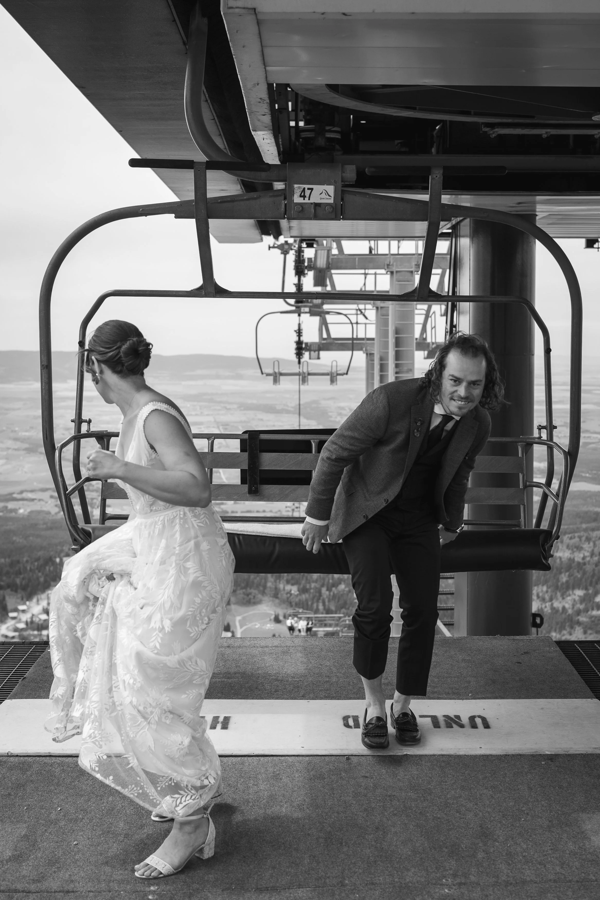 Grand Targhee Resort, documentary Wedding photography; Bride and groom step off Dream Catcher Lift