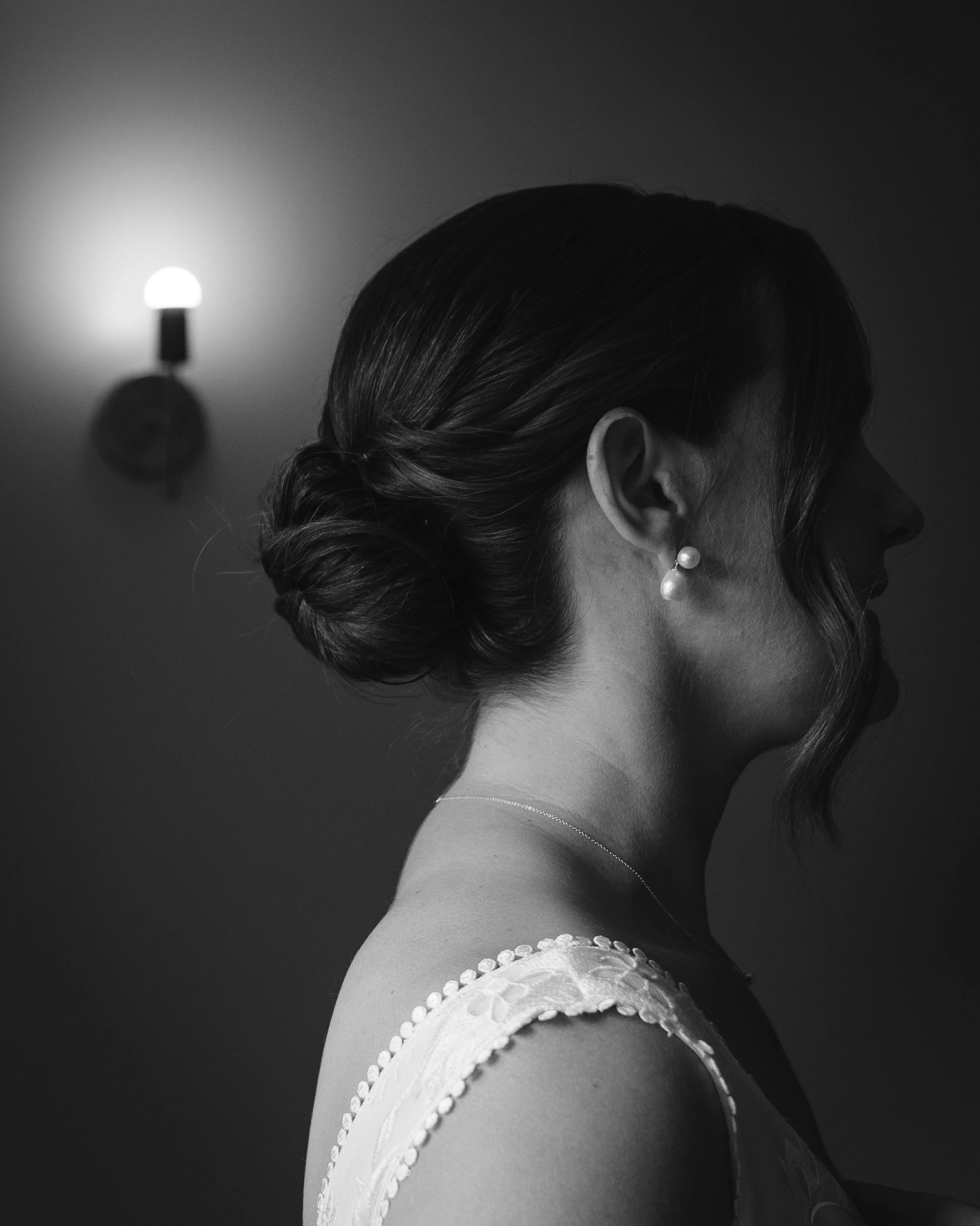 Black and white photo of bride with pearl earrings at Grand Targhee Resort