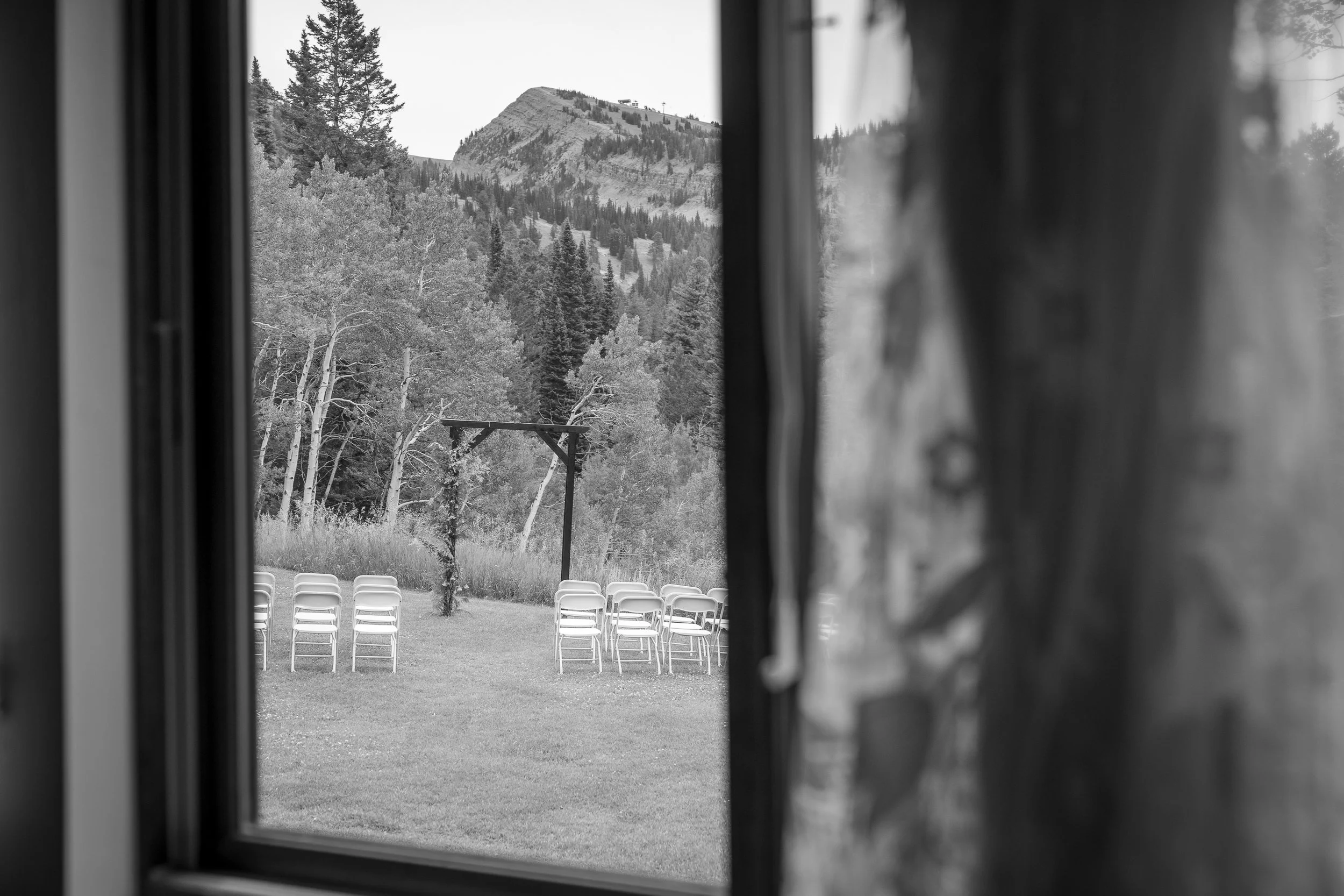 wedding dress hanging in window at Grand Targhee Resort