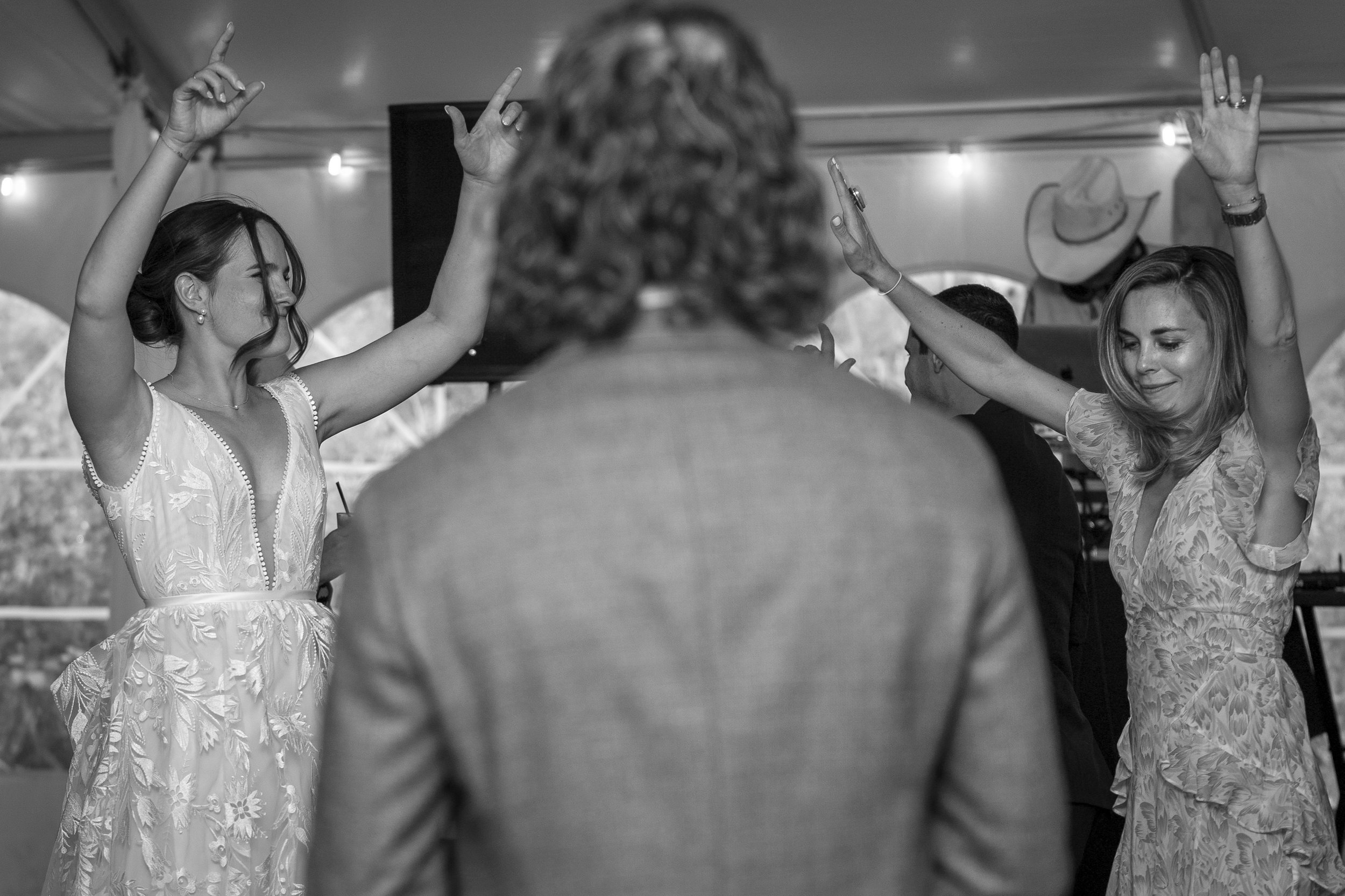 Grand Targhee Resort, documentary Wedding photography; bride and guest dancing with groom in foreground