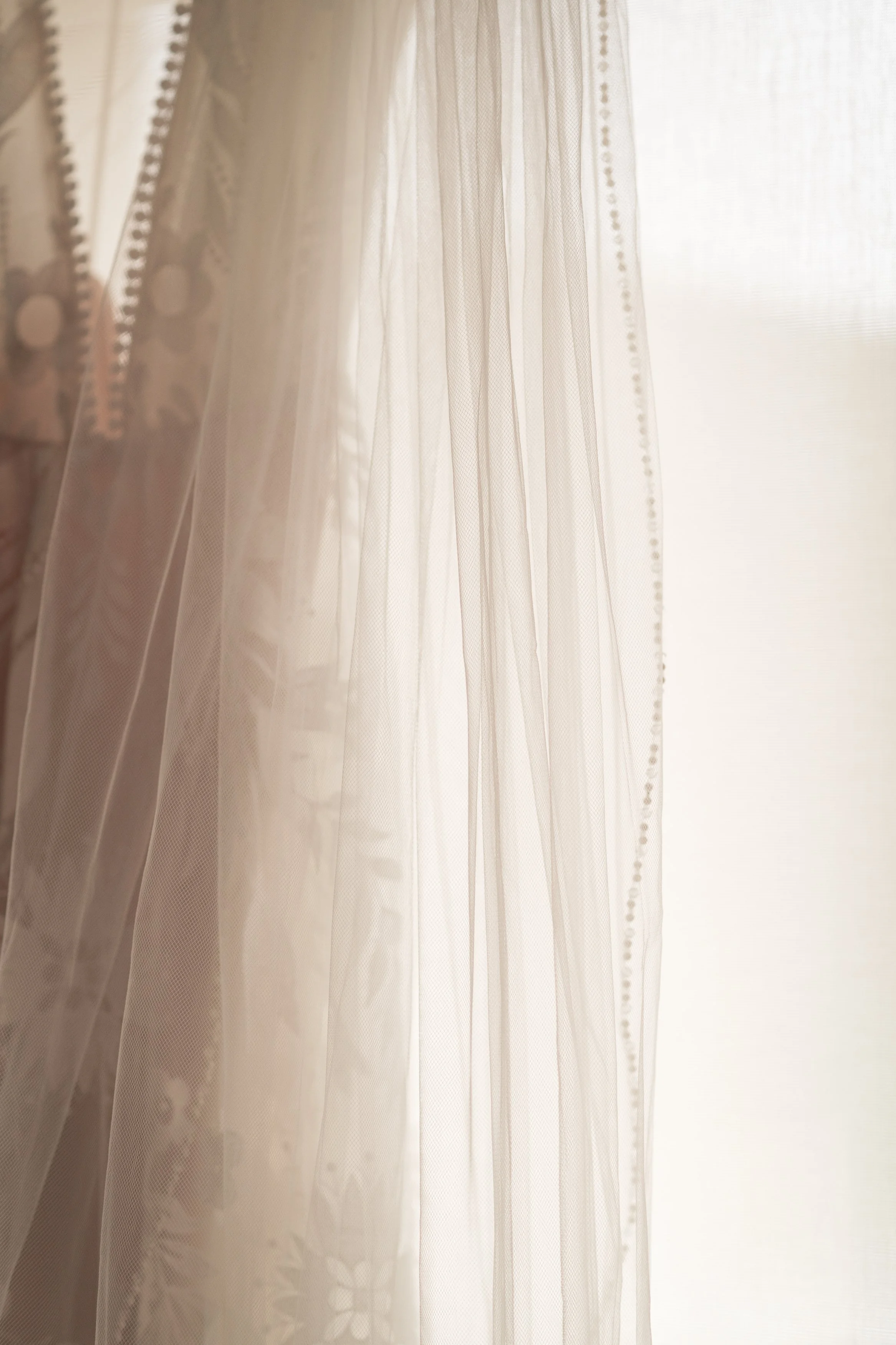 Wedding dress hanging in window at Grand Targhee Resort