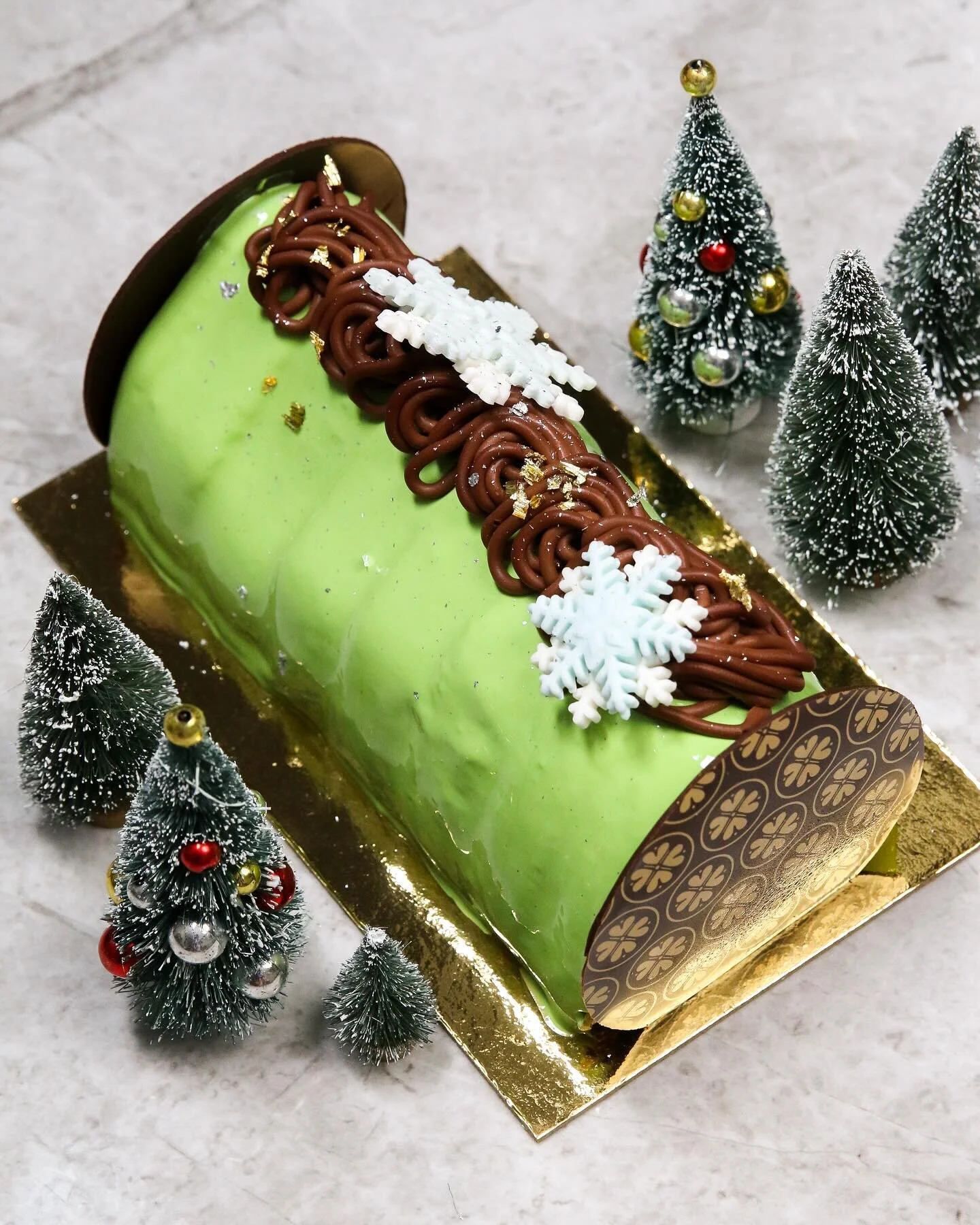 A light dusting of snow on our second b&ucirc;che de no&euml;l of this holiday season ~ chocolate joconde, chocolate custard, cassis, Valrhona Alpaco feuilletine crisps, pistachio mousse, rum ganache.

Our festive B&ucirc;che de No&euml;l cakes are n
