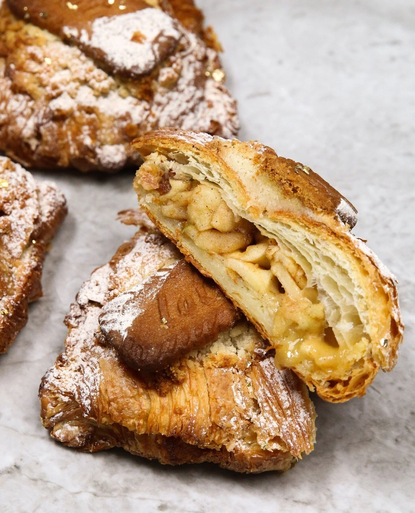 For this holiday season, we're bringing back one of the most popular croissants at the bakery but with a festive twist! This weekend, enjoy our sp&eacute;culoos apple pie croissant filled with sp&eacute;culoos spiced cookies, almond frangipane, and r