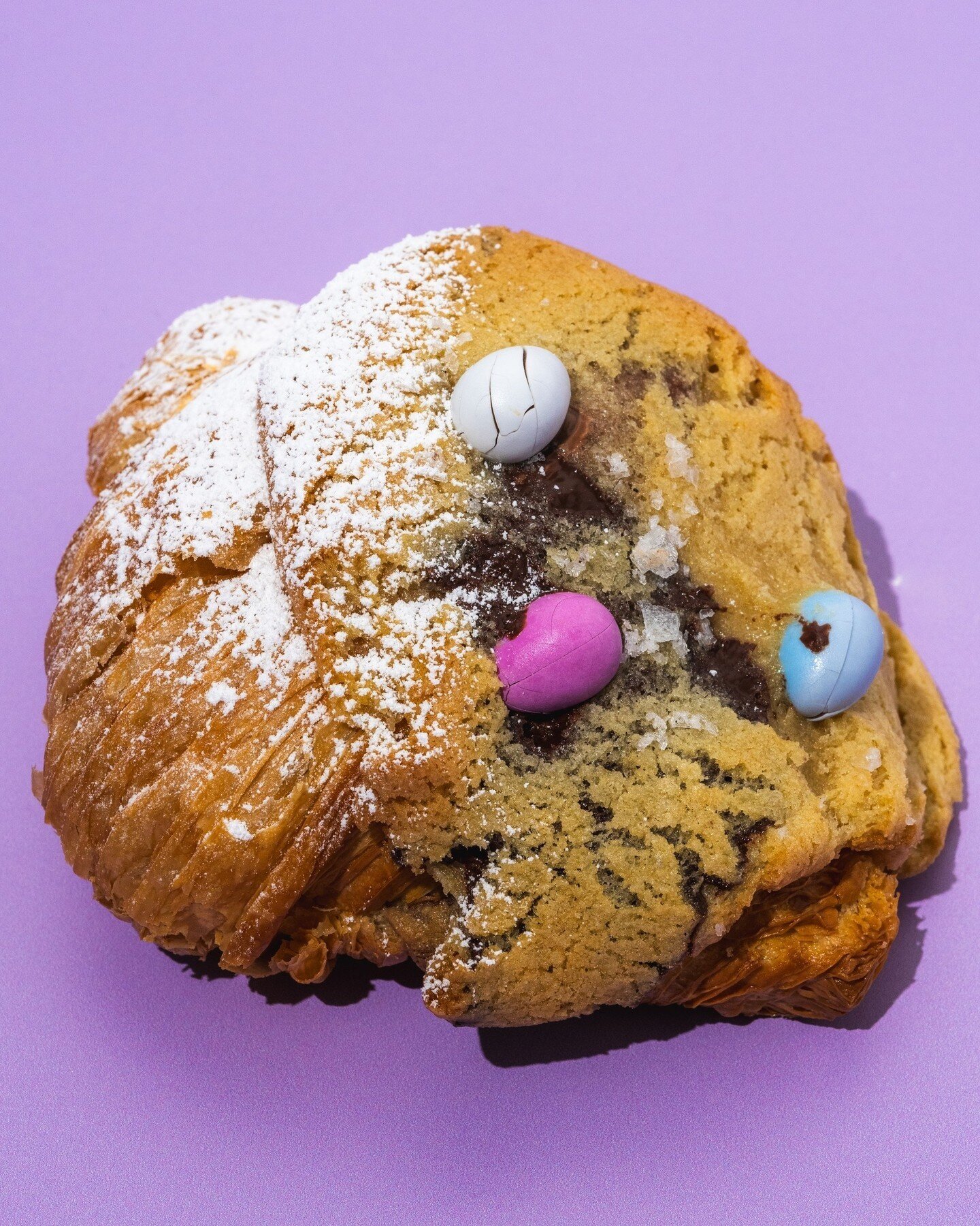 THE EGGS-CELLENT COOKIE CROISSANT! 🐣⁠
⁠
Available at the bakery starting this upcoming Monday, the cookie croissant features our classic butter croissant filled with Valrhona chocolate chip cookie dough and topped with more cookie dough and milk cho