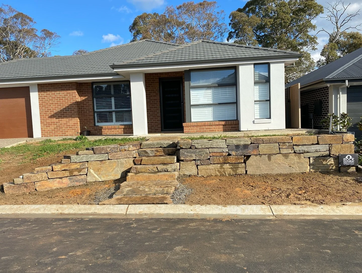 Is there a more classic combination then bluestone walls and the Adelaide Hills? We think not. 
This Mount Barker, Clover Park project features a large bluestone wall with natural stone steps and matching steppers. A great foundation to a classic Ade
