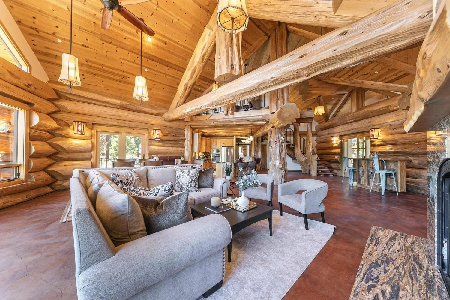 Living area with handcrafted log construction details at 12804 Quail Ln in Truckee, per the listing.