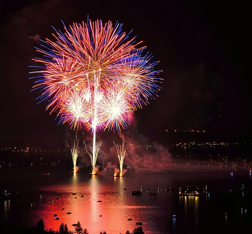 Fireworks exploding over Lake Tahoe at night during the Lights on the Lake show at South Shore on the Fourth of July.