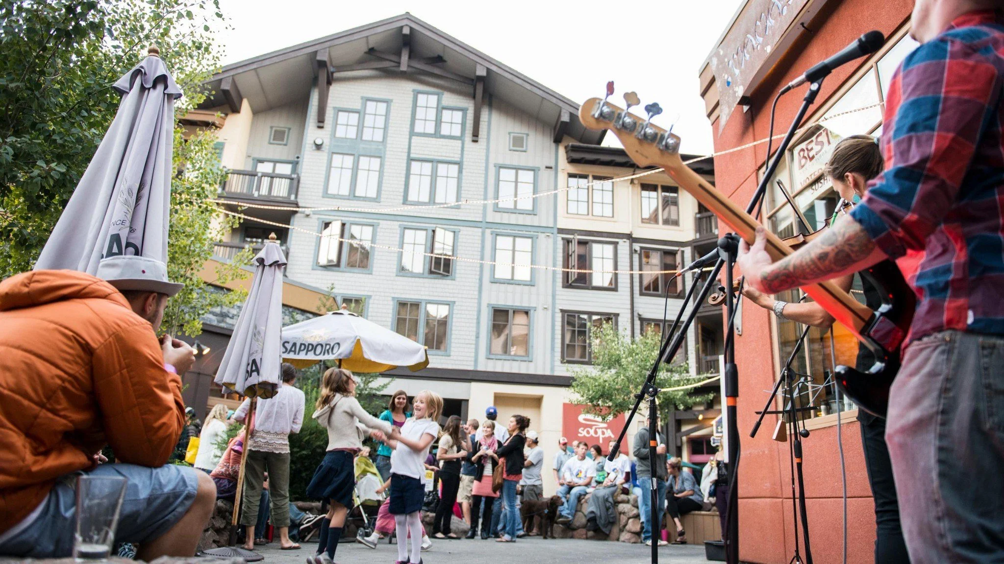 Crowd gathered outdoors in The Village at Palisades Tahoe during Brews, Jazz & Funk.