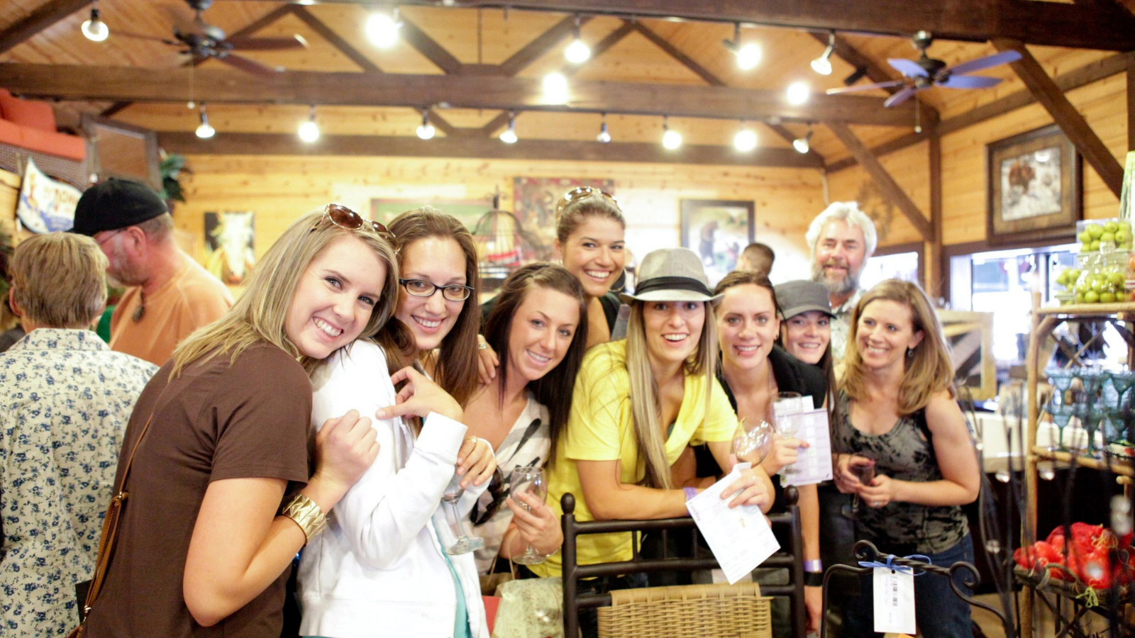 A group of attendees gathers at a Downtown Truckee Wine, Walk & Shop tasting stop.