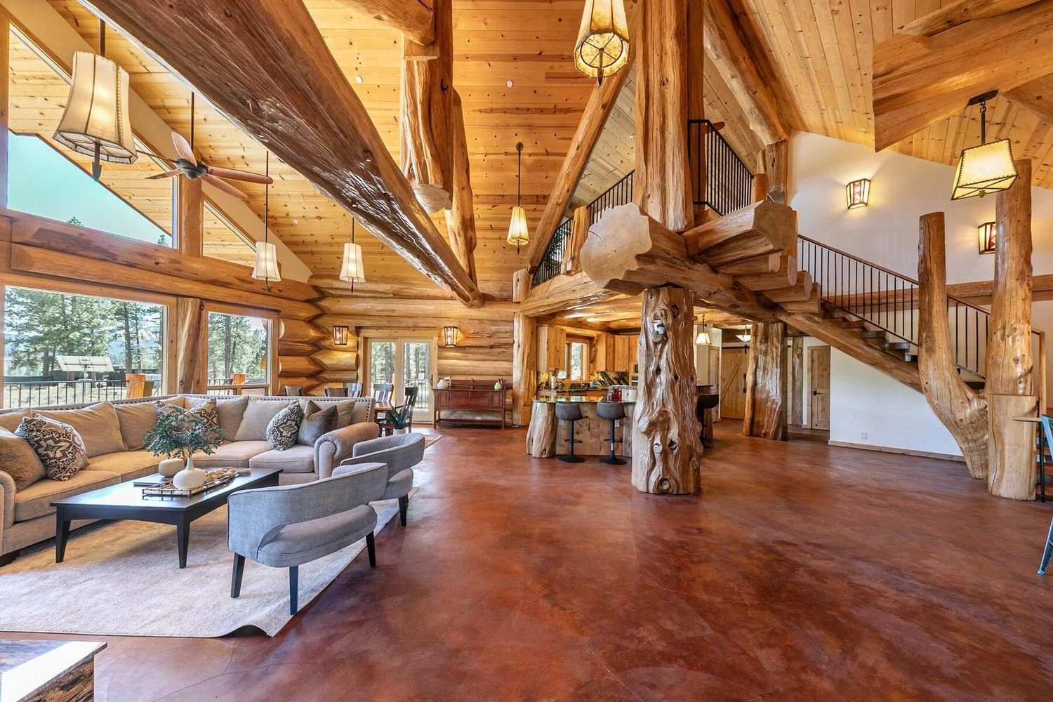 Interior great room with handcrafted log beams at 12804 Quail Ln in Truckee, per the listing.
