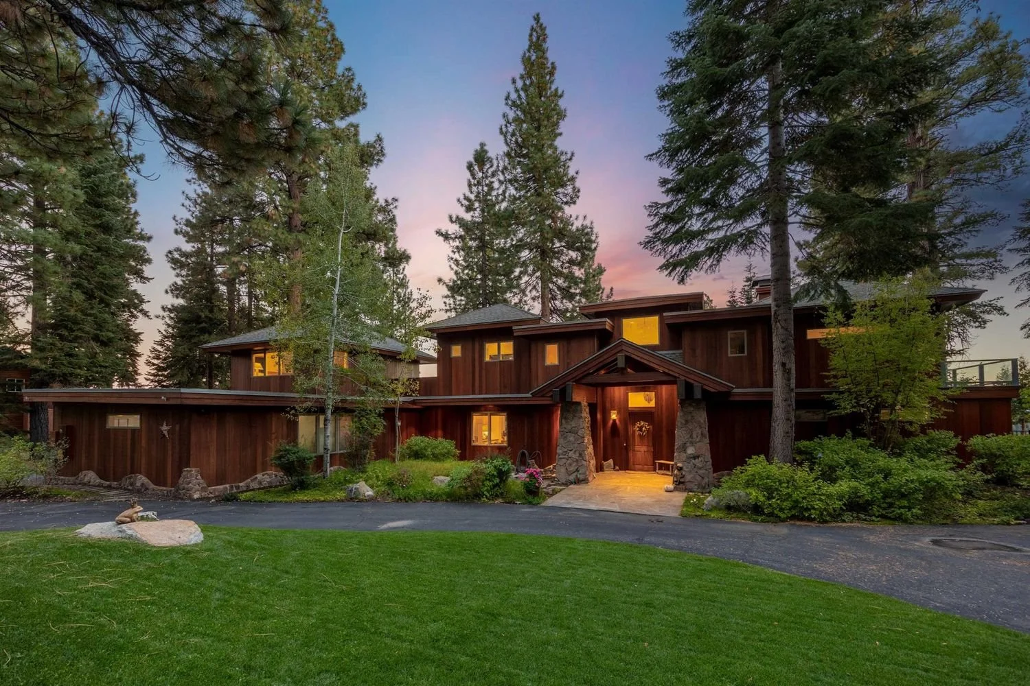 Exterior view of 200 Rim Dr in Tahoe Vista surrounded by trees, per the listing.