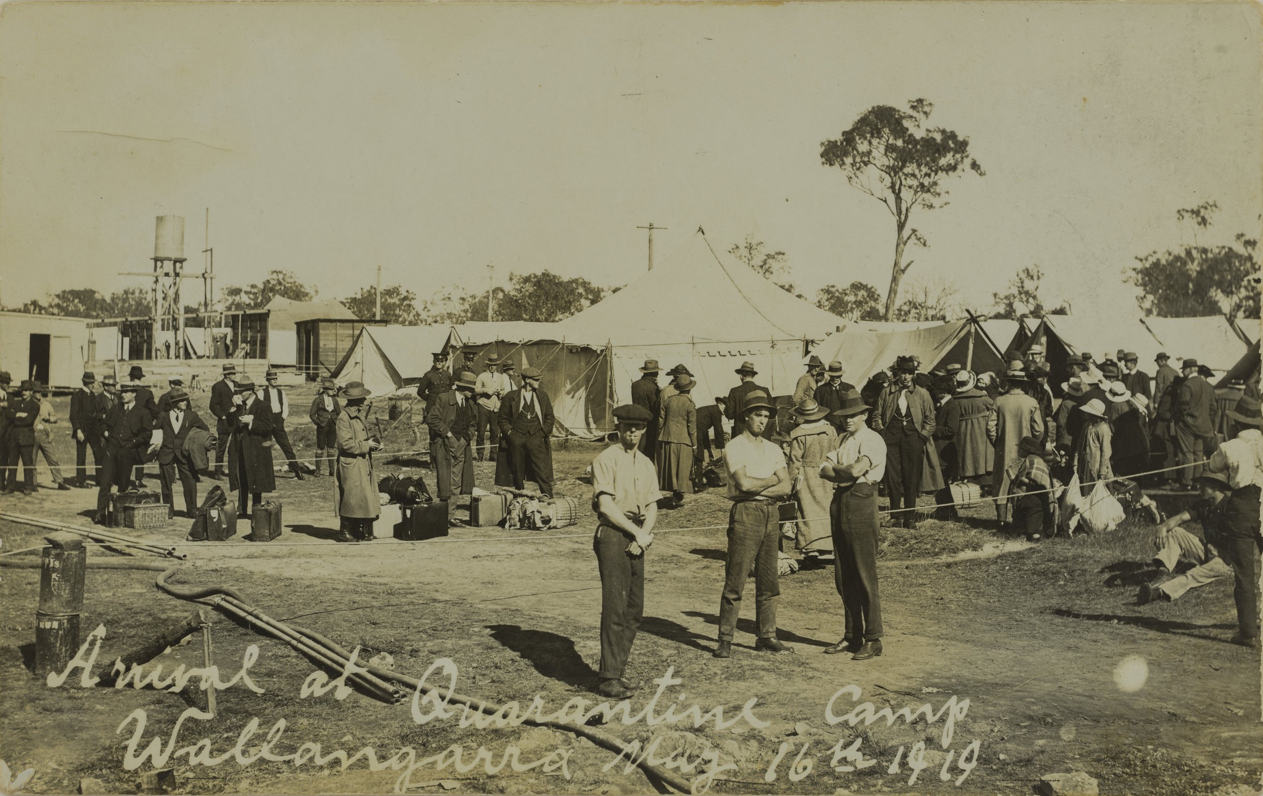 Groups of people with their belongings on arrival at the Wallangarra Quarantine camp, May 1919 SLQ.jpg