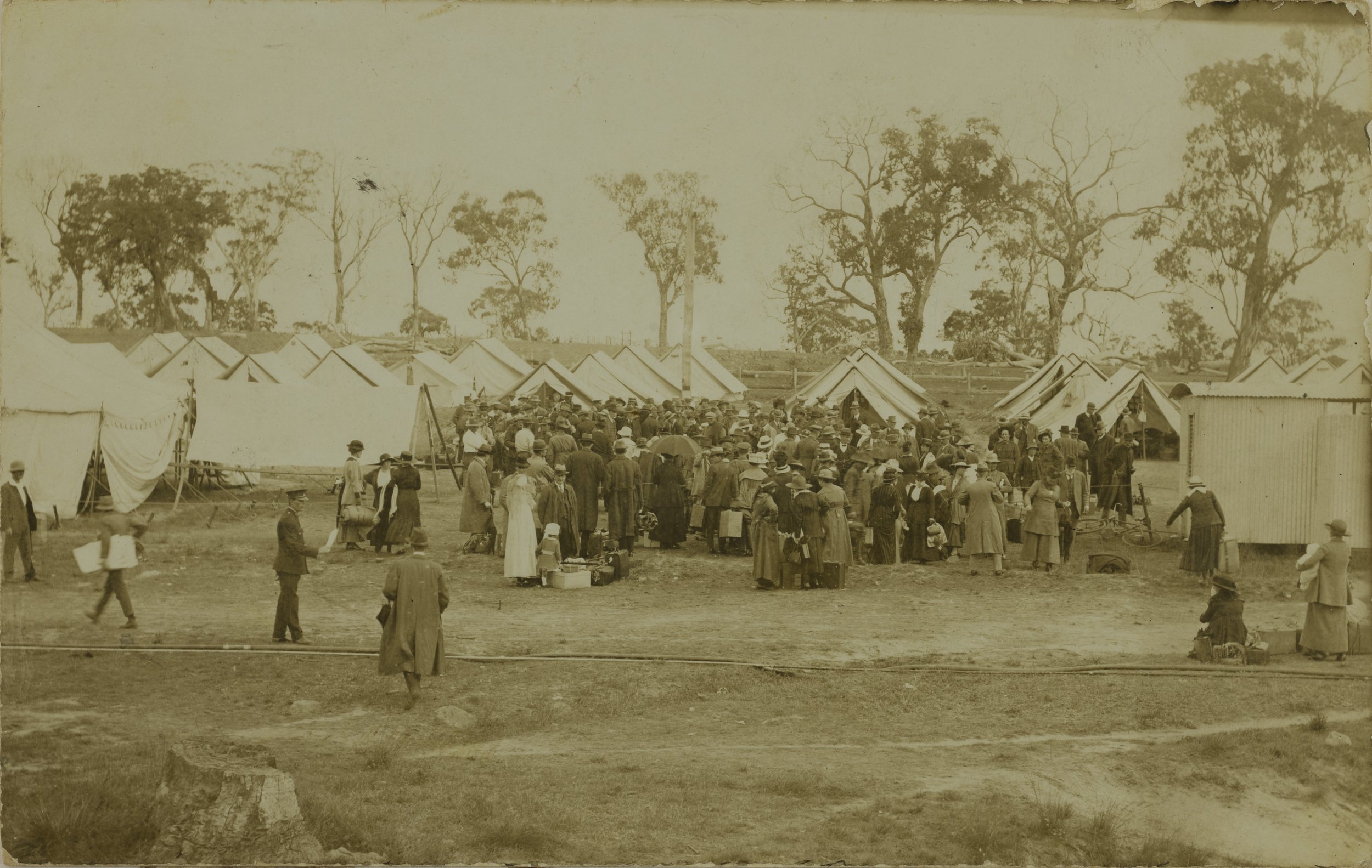Men, women and children line up for admission to the Wallangarra Quarantine camp, 1919 SLQ.jpg