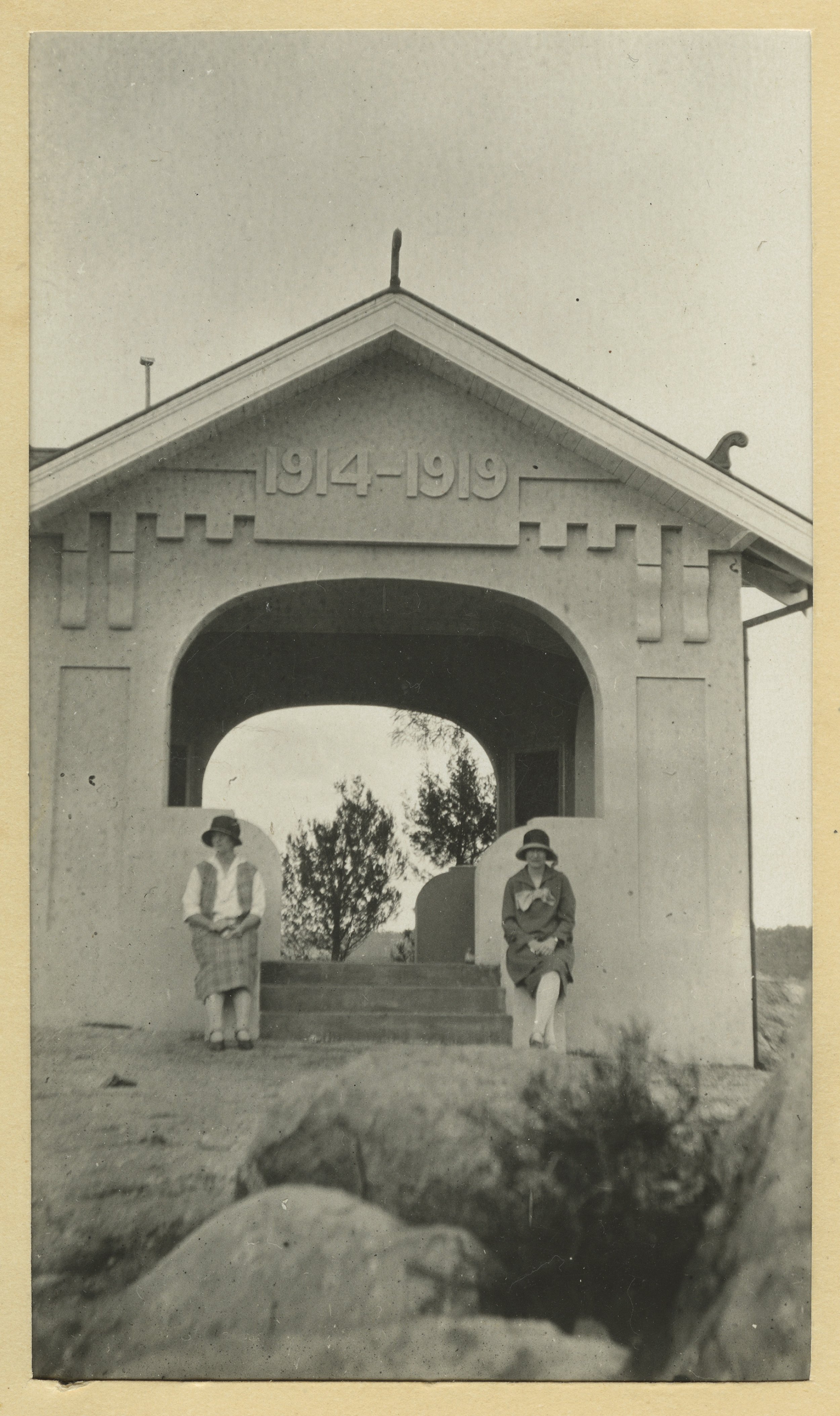 Two ladies seated each side of the entrance to the Soldier's Memorial, Stanthorpe, ca. 1925 SLQ.jpg