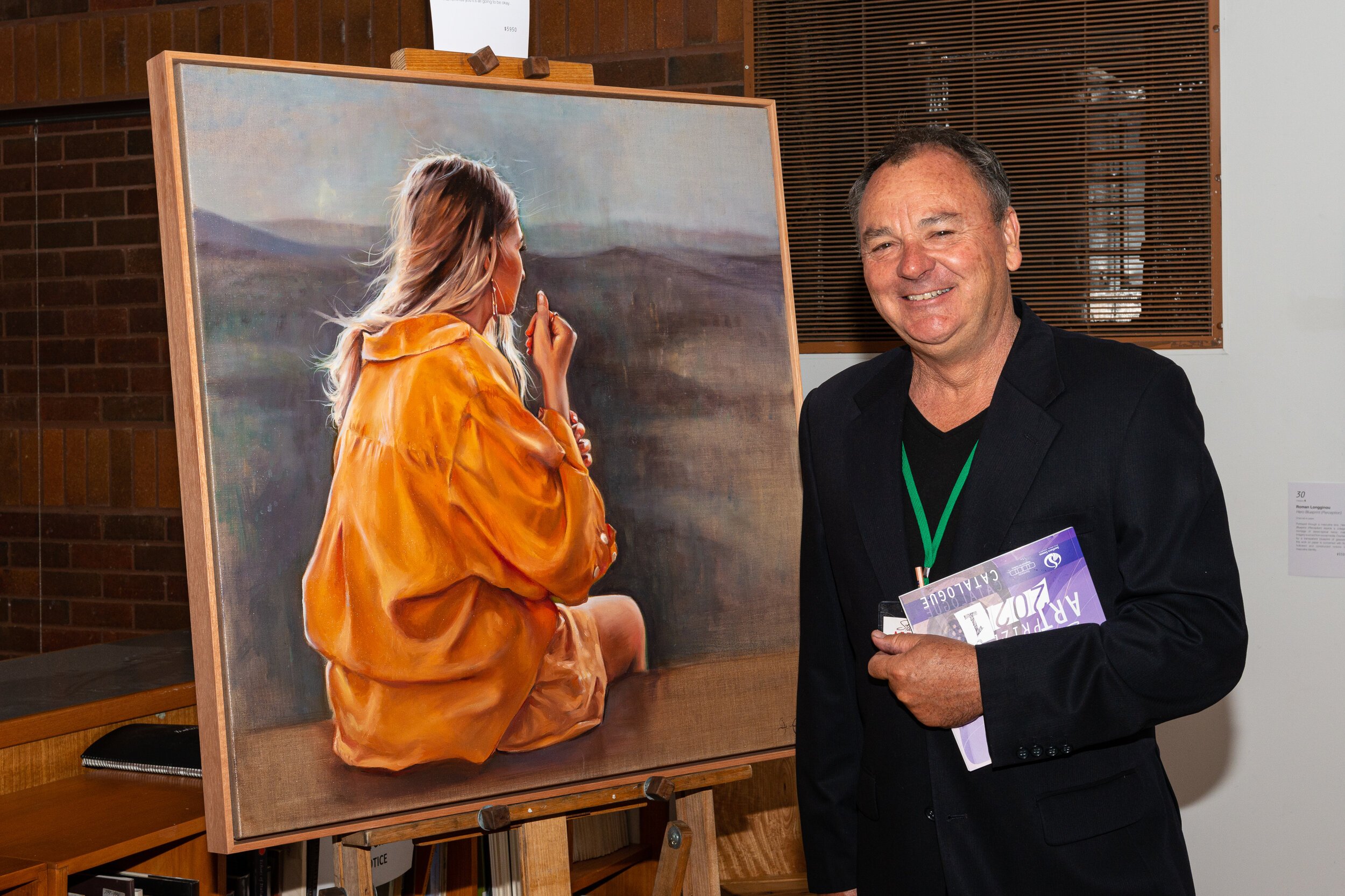 Mark Ravenscroft - attendee with painting by Jess Le Clerc- photo by Keith Barnett