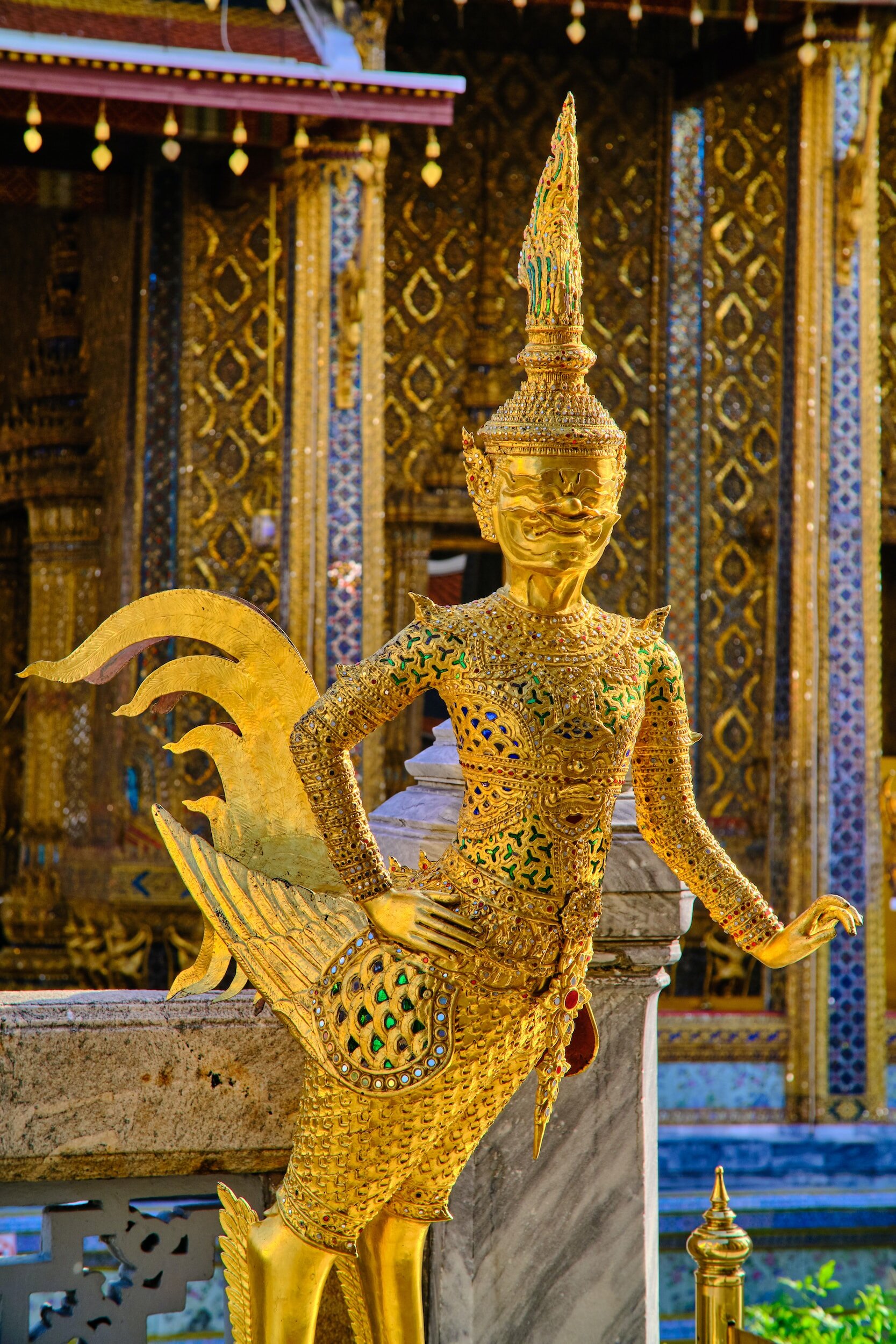 Thai temples are known for their intricate adornments, often in pure gold
