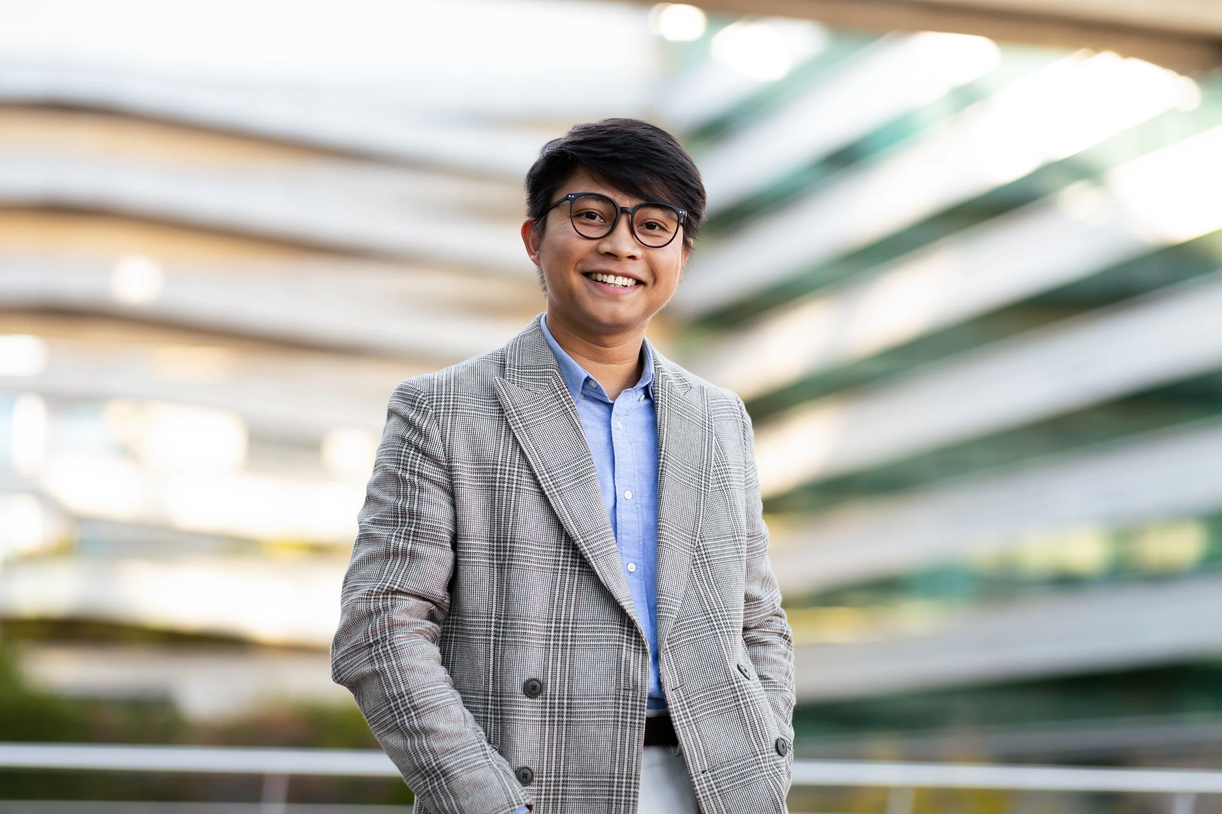 professional-man-smiles-confidently-outside-modern-2025-03-18-18-28-35-utc.jpg